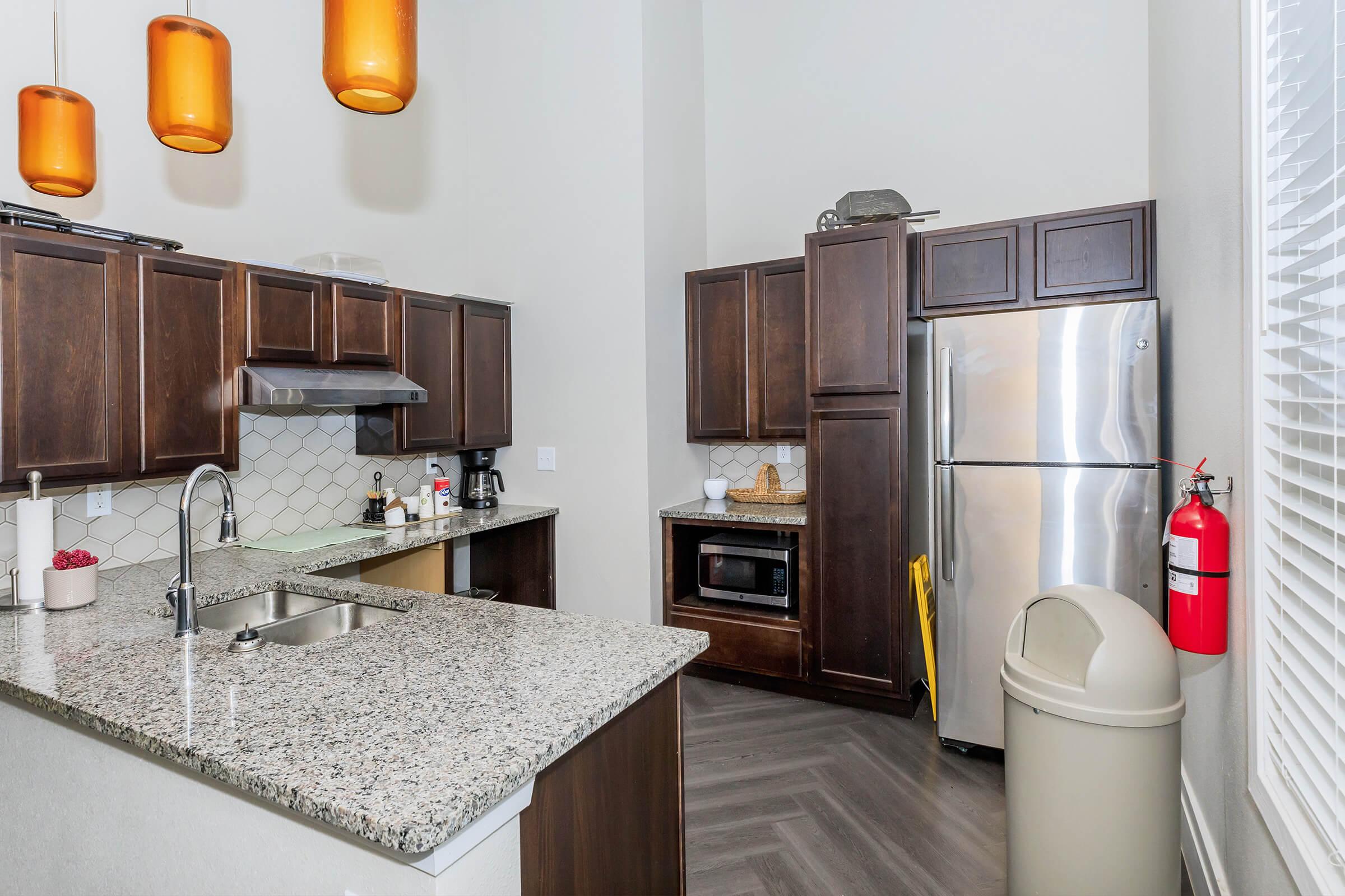 a kitchen with a sink and a refrigerator