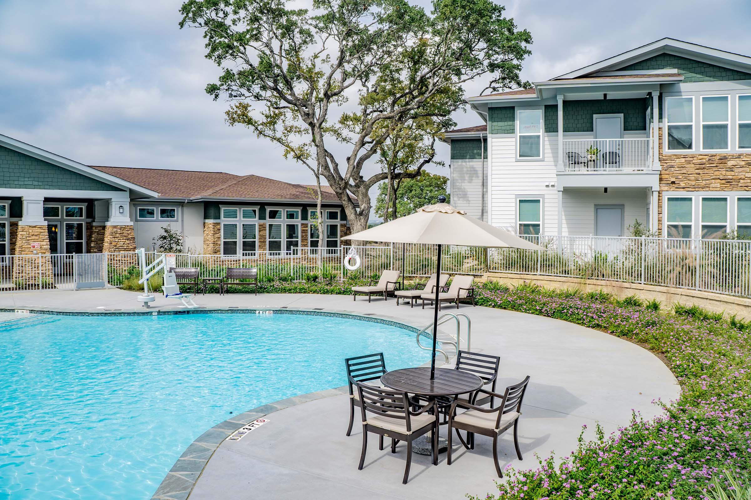 a large pool of water in front of a house