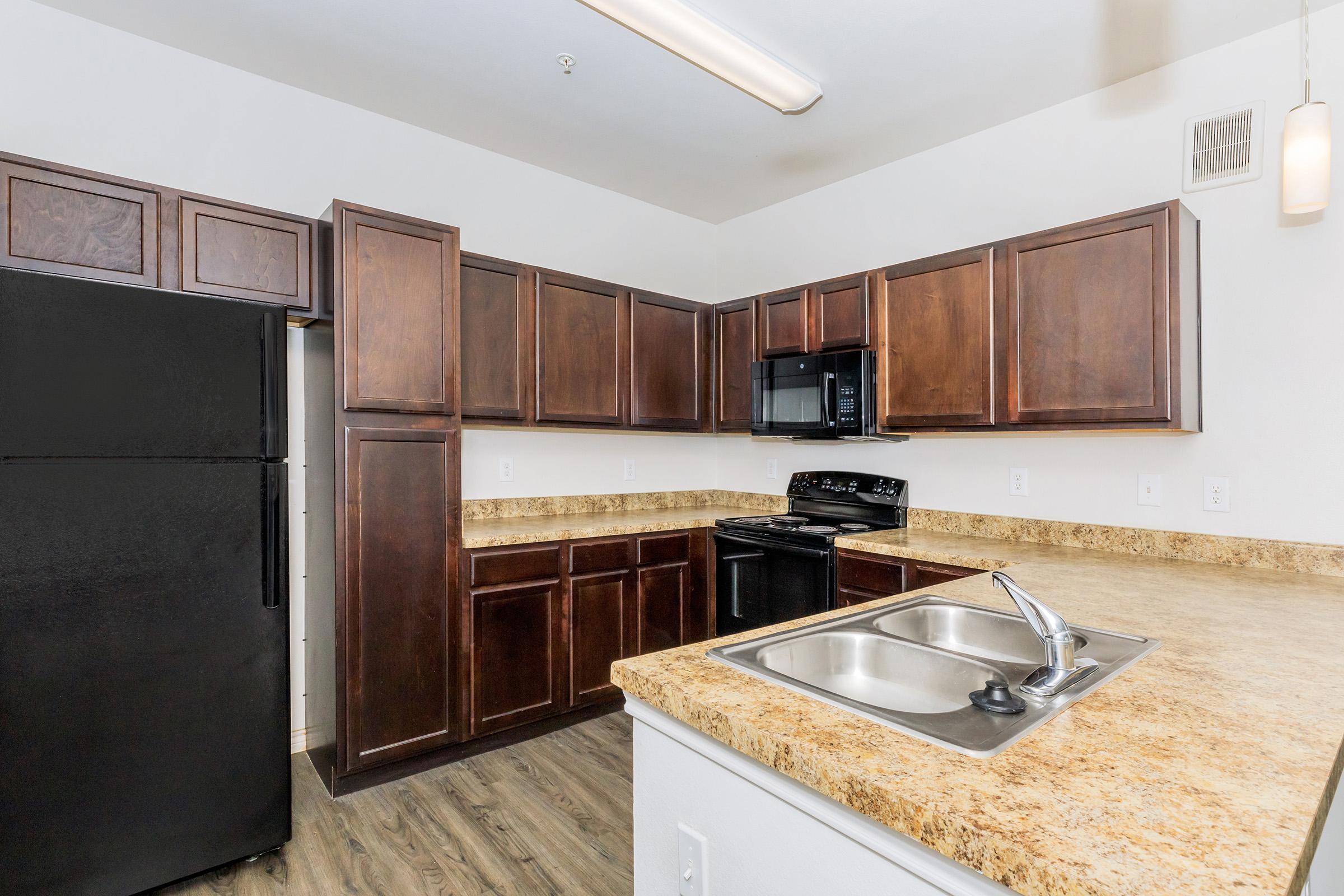 a large kitchen with stainless steel appliances