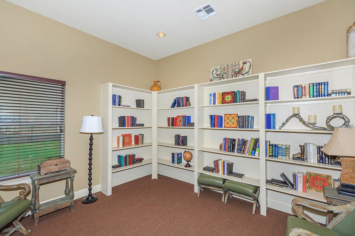 a living room filled with furniture and a tv