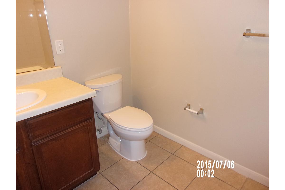 a white tub sitting next to a sink