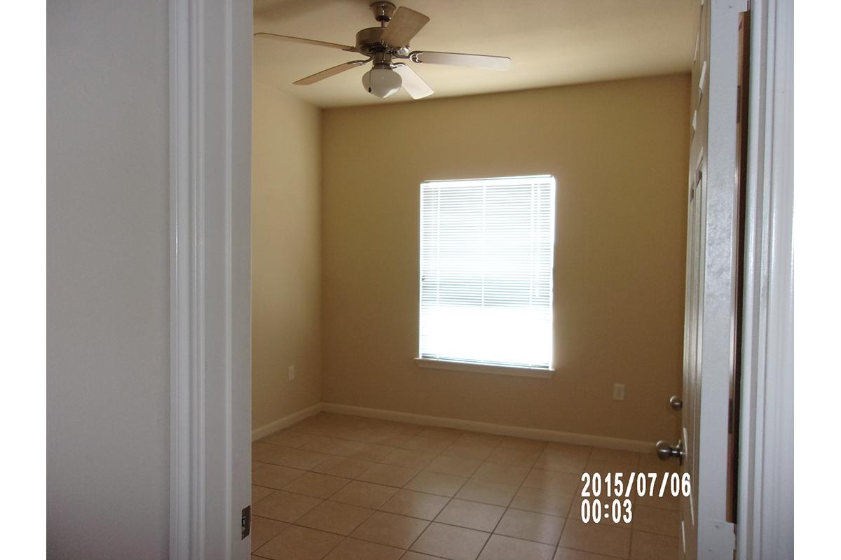 a white sink sitting under a window