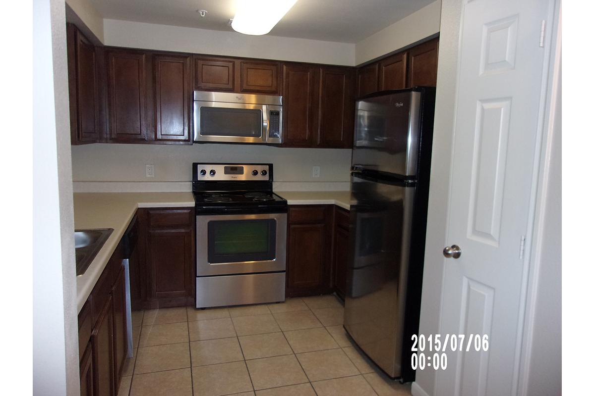 a kitchen with a stove and a microwave