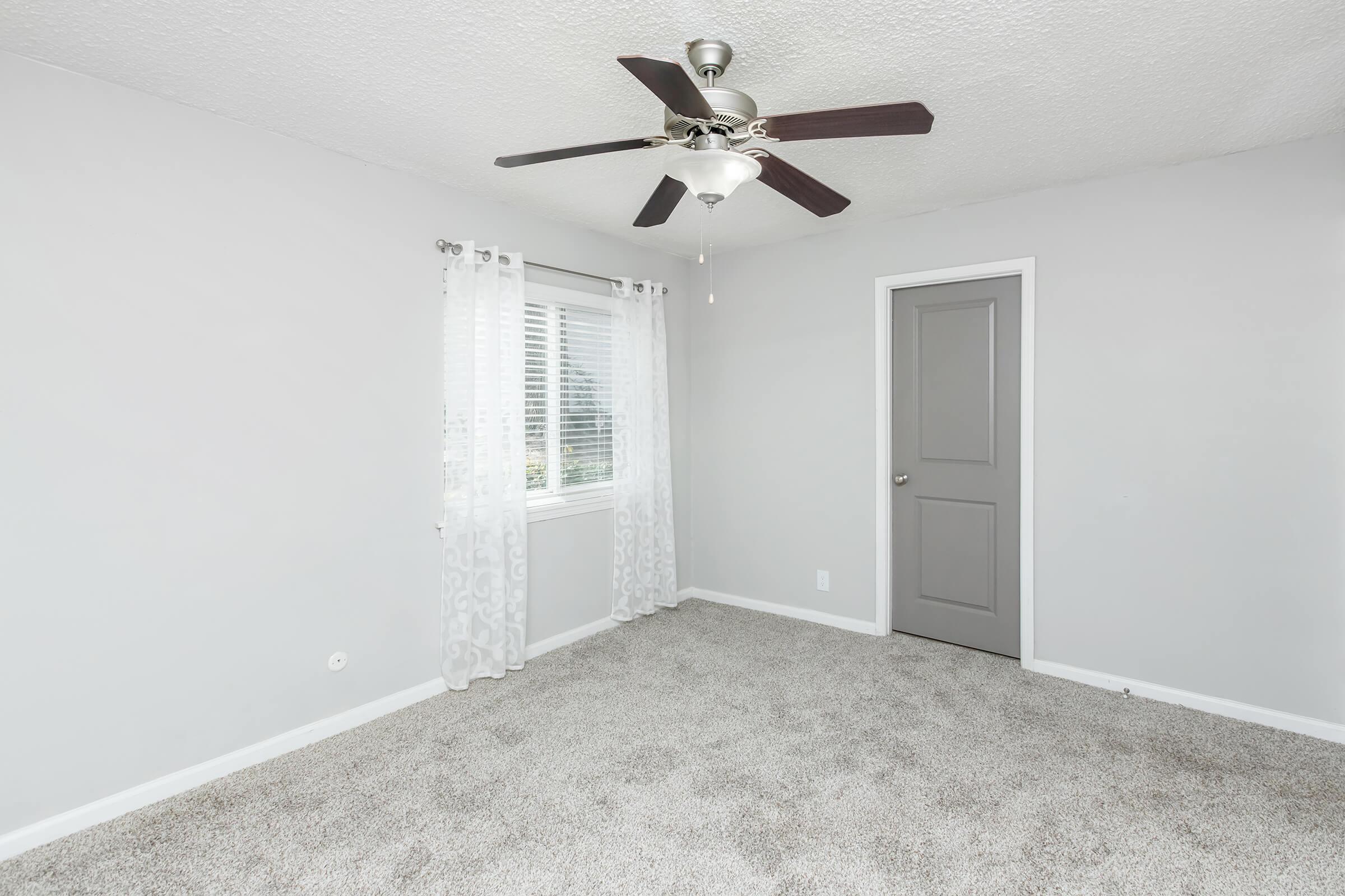 spacious bedroom with carpeted floor