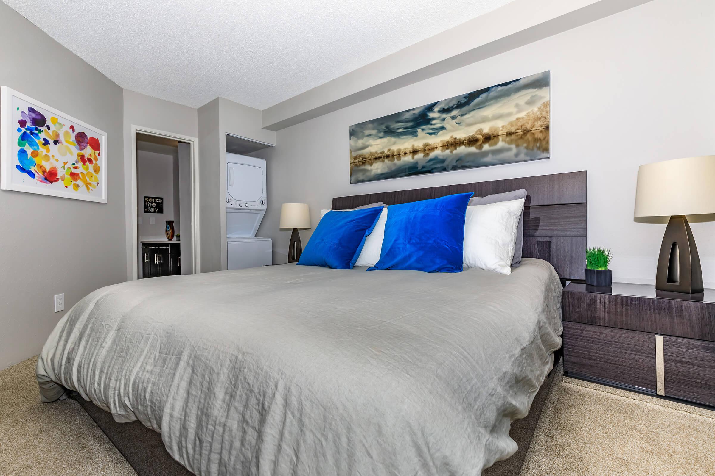 a bedroom with a large bed in a hotel room