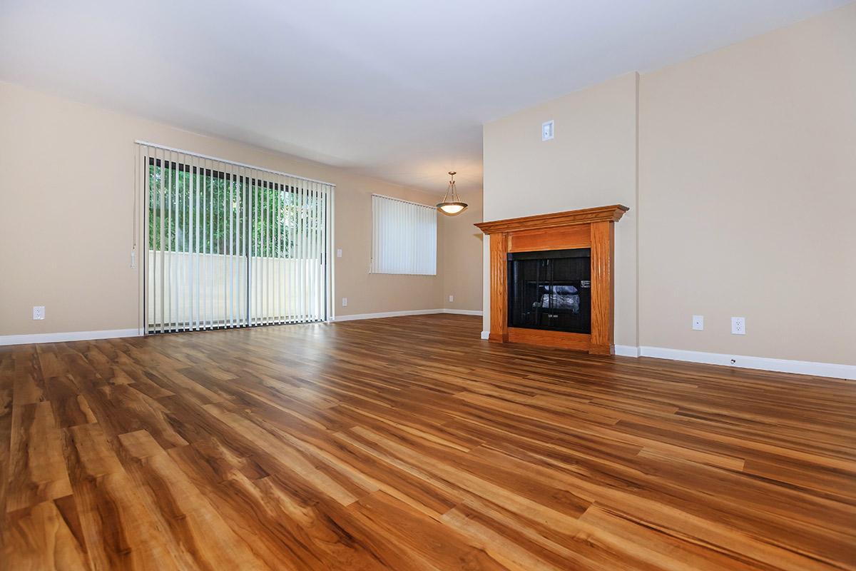 a view of a living room with a wood floor