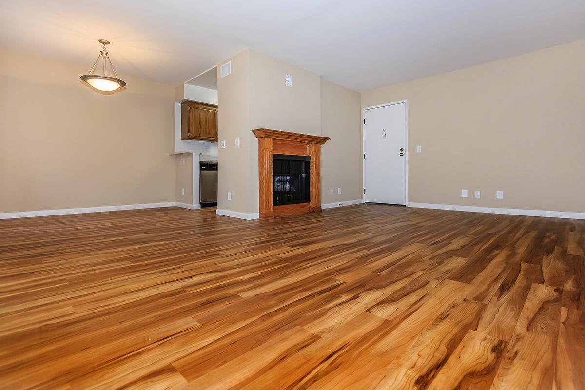 a large empty room with a wood floor
