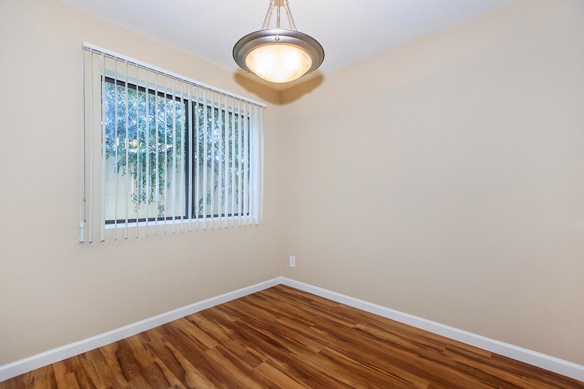 a bedroom with a bed and a mirror