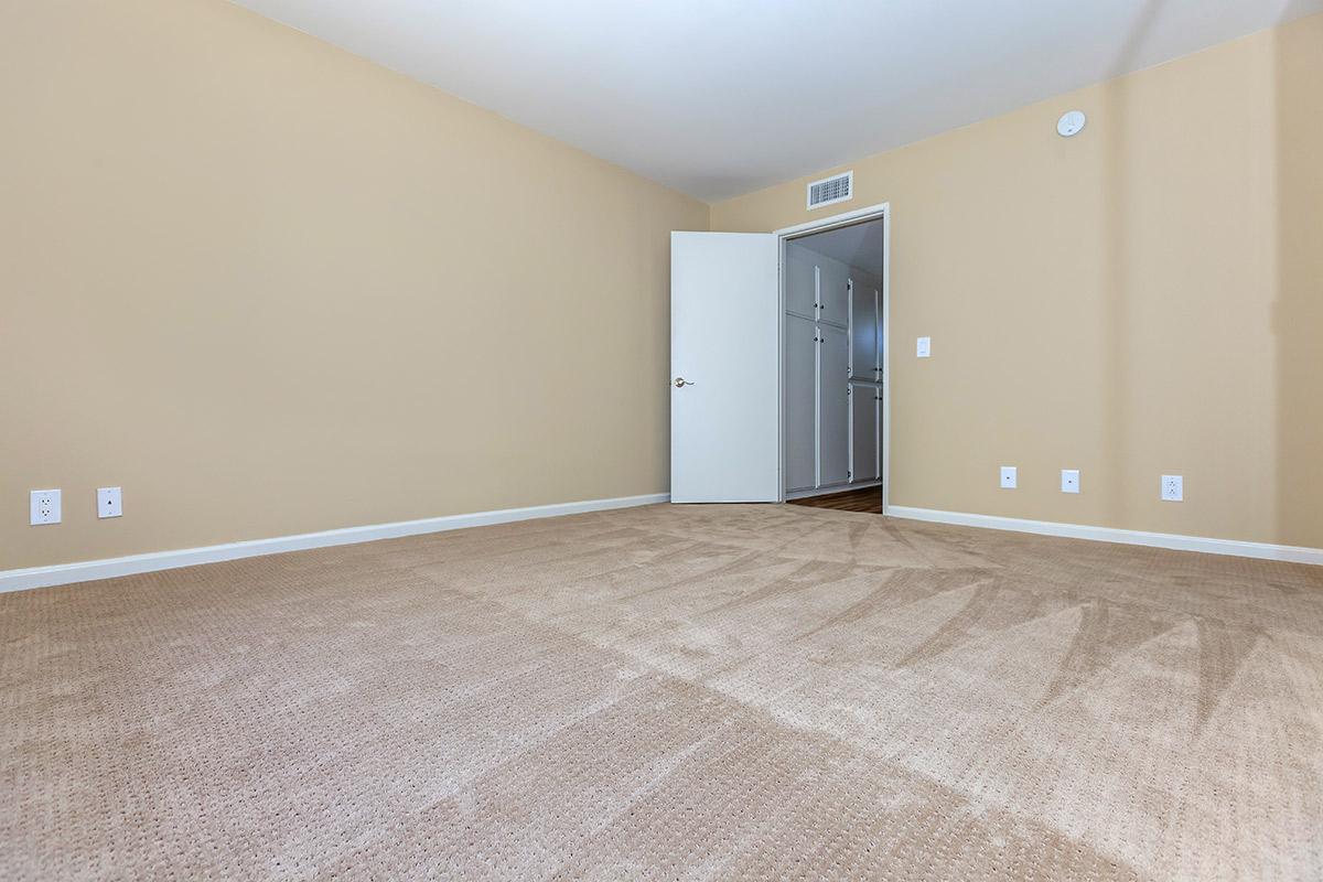 an empty bed in a room