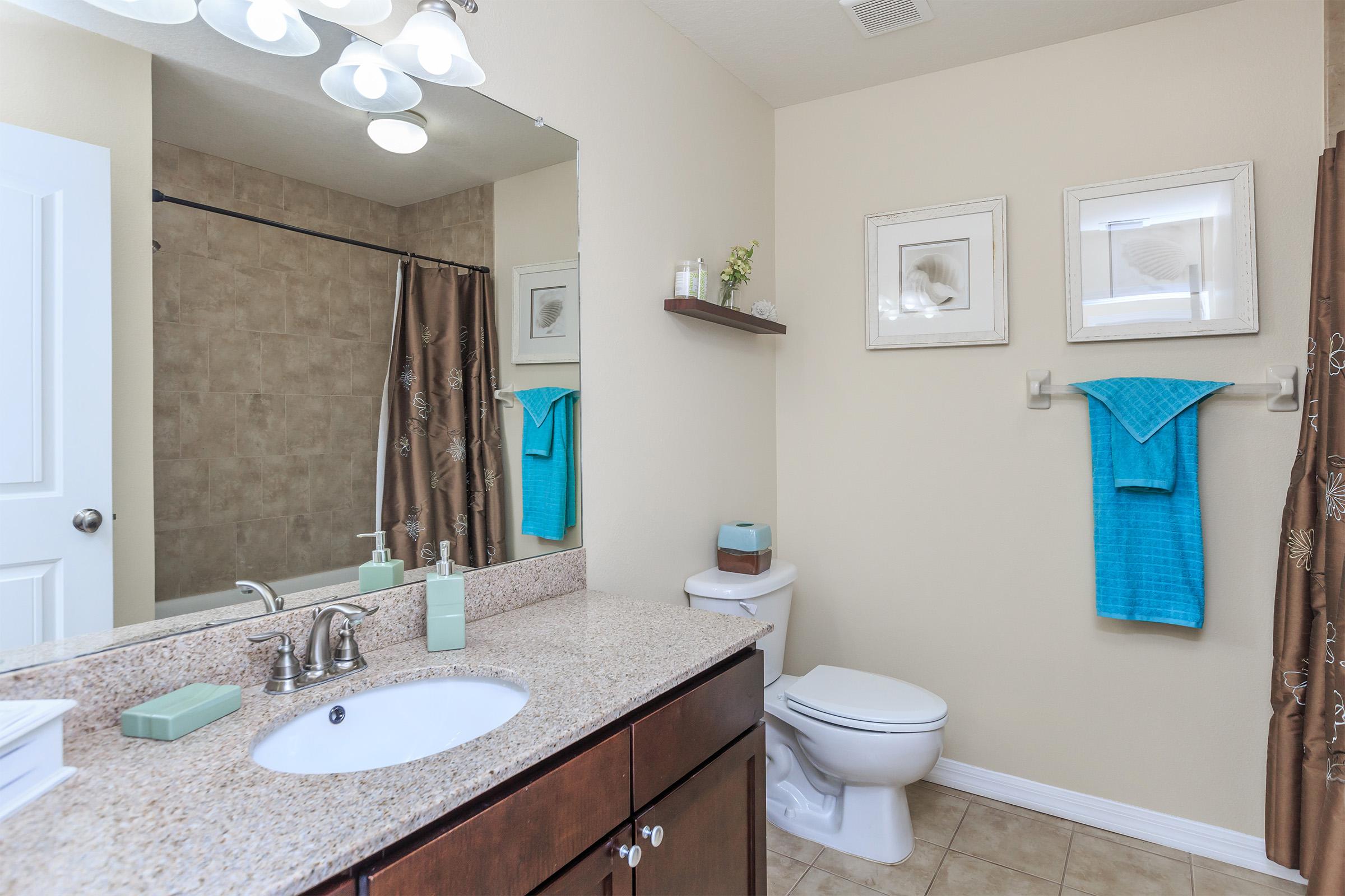 a room with a sink and a mirror