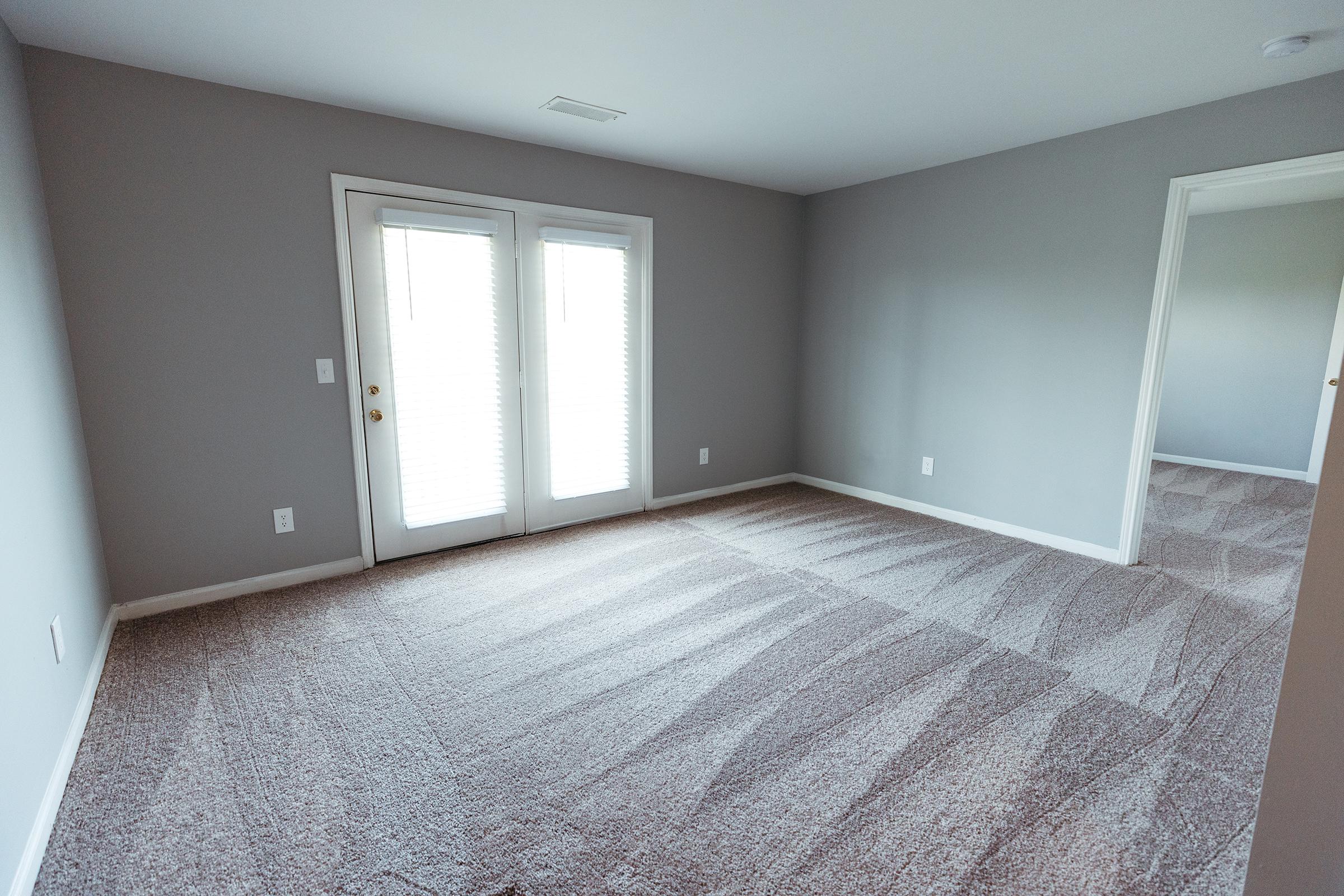 Living room area with exterior doors.