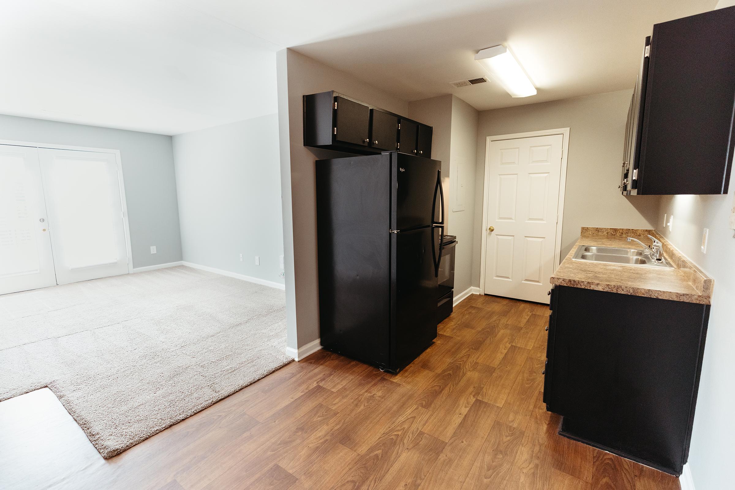 Side view of kitchen entry facing living room area.