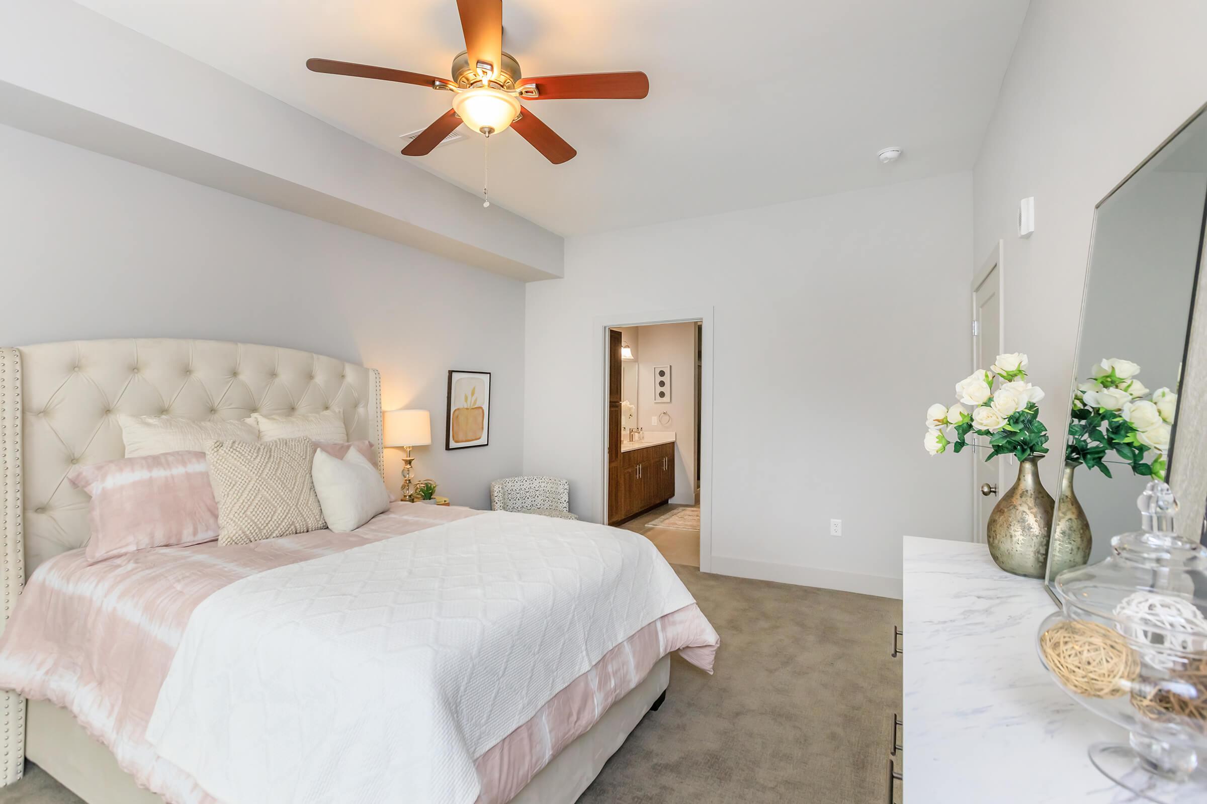 a bedroom with a large bed in a hotel room