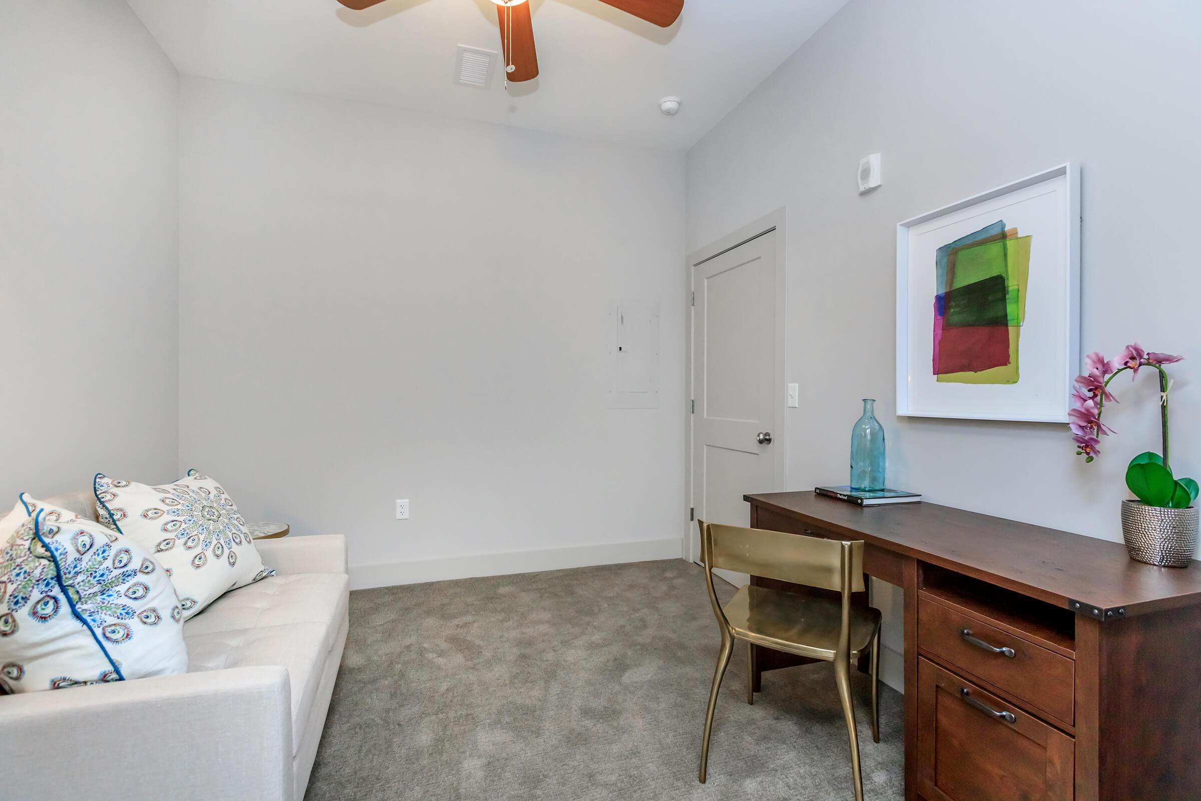 a living room with a sink and a mirror