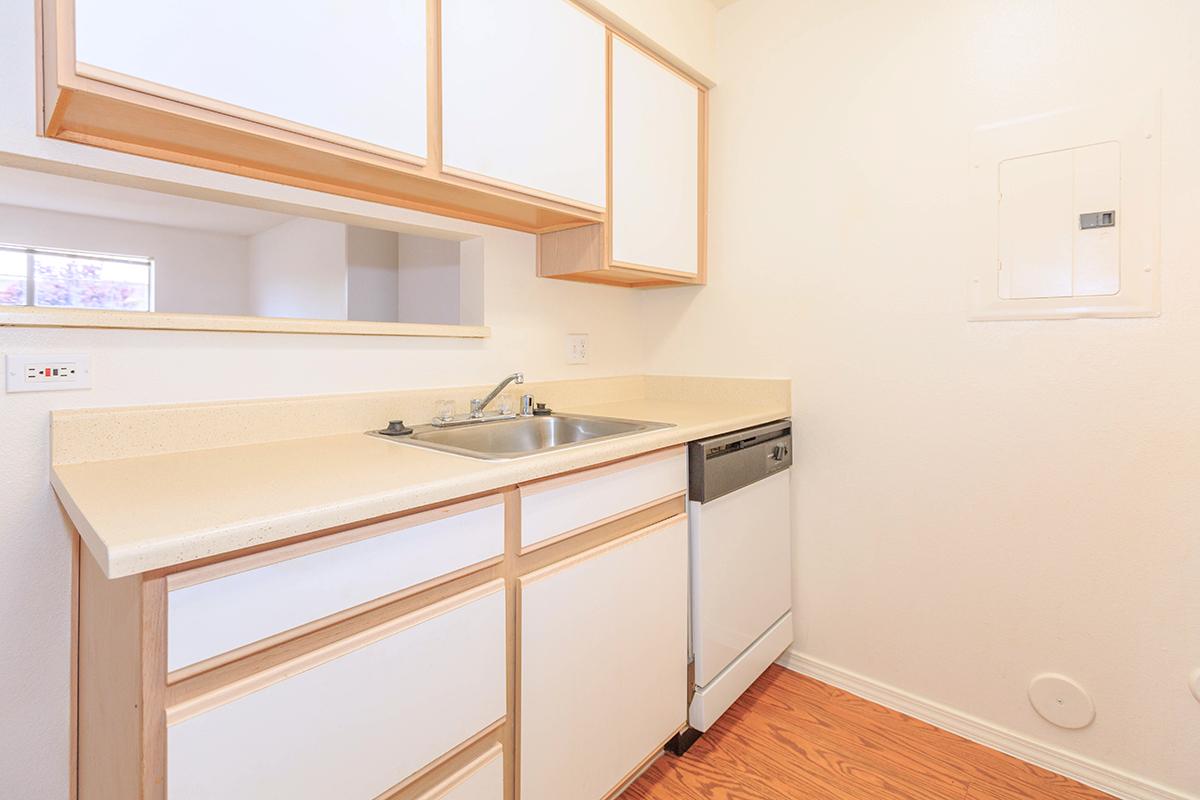 a kitchen with a sink and a window