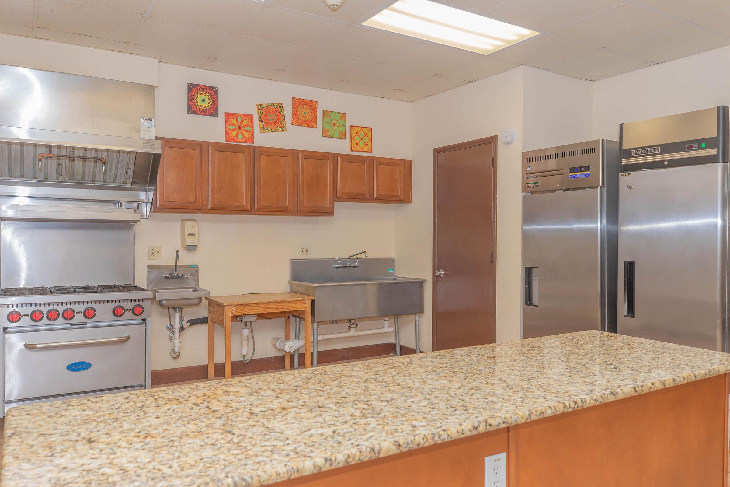 a stainless steel refrigerator in a kitchen