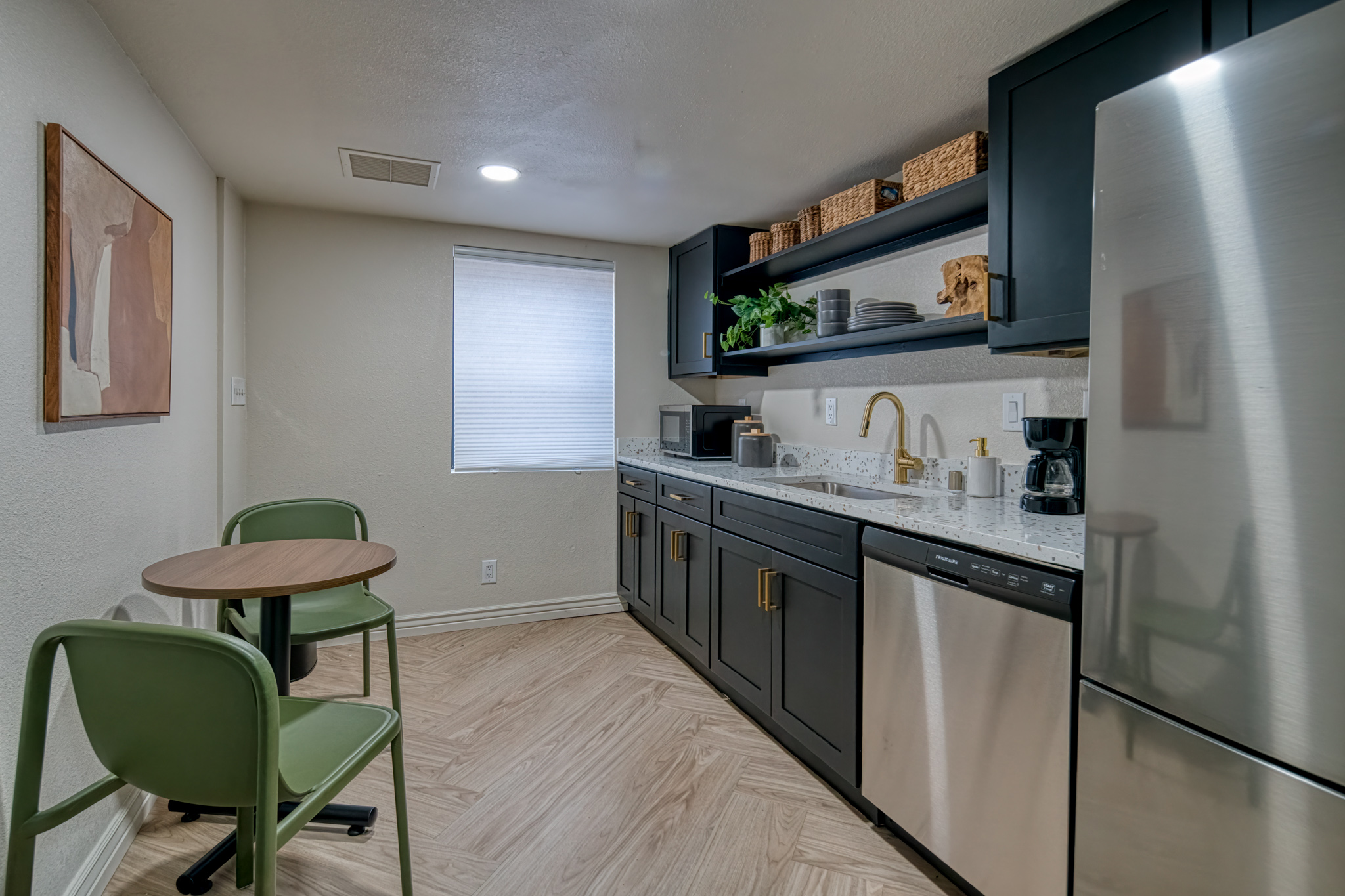 Clubhouse kitchenette with stainless steel appliances at Treehouse  Leasing Office in 
