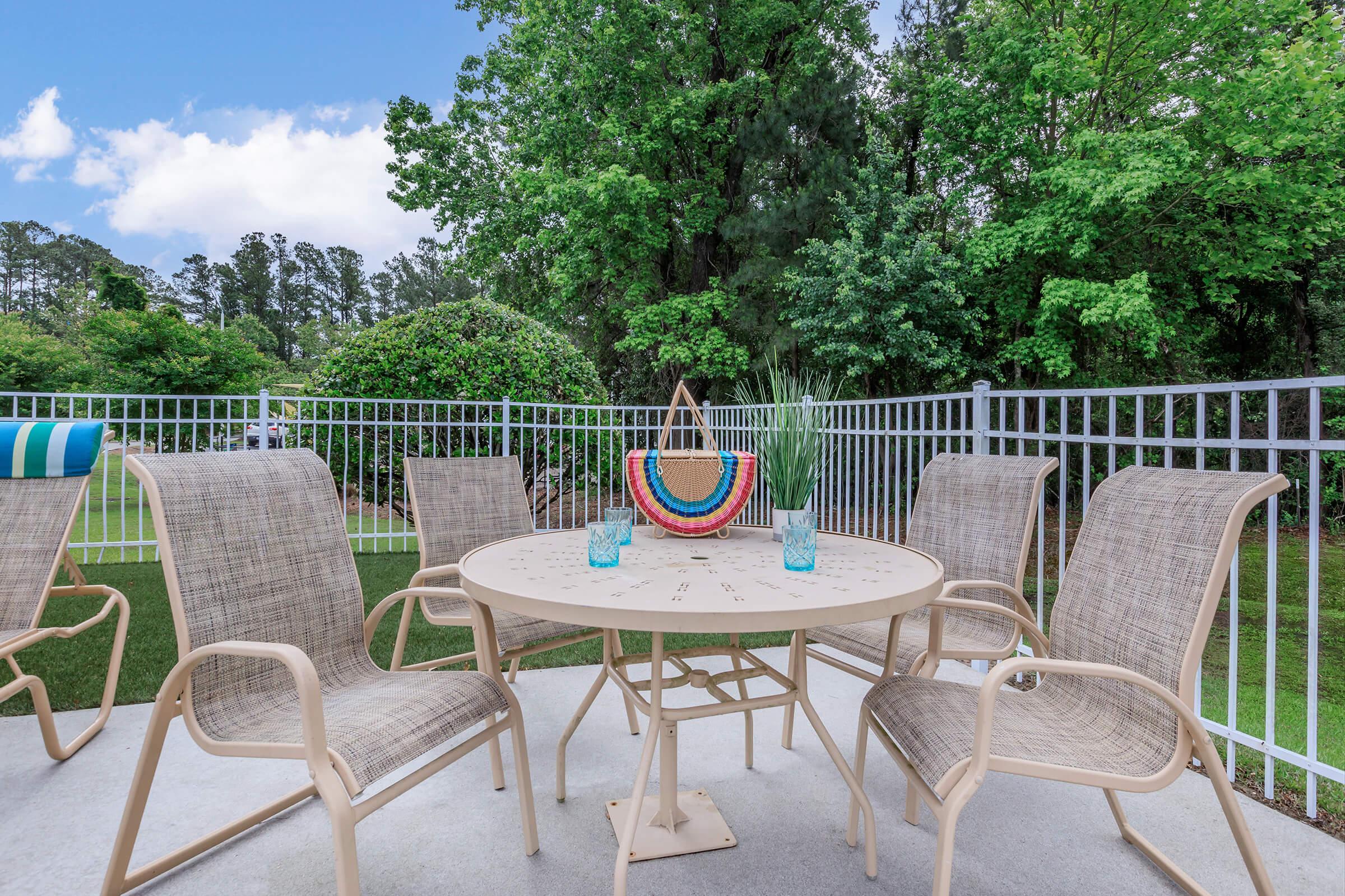 a couple of lawn chairs sitting on top of a table