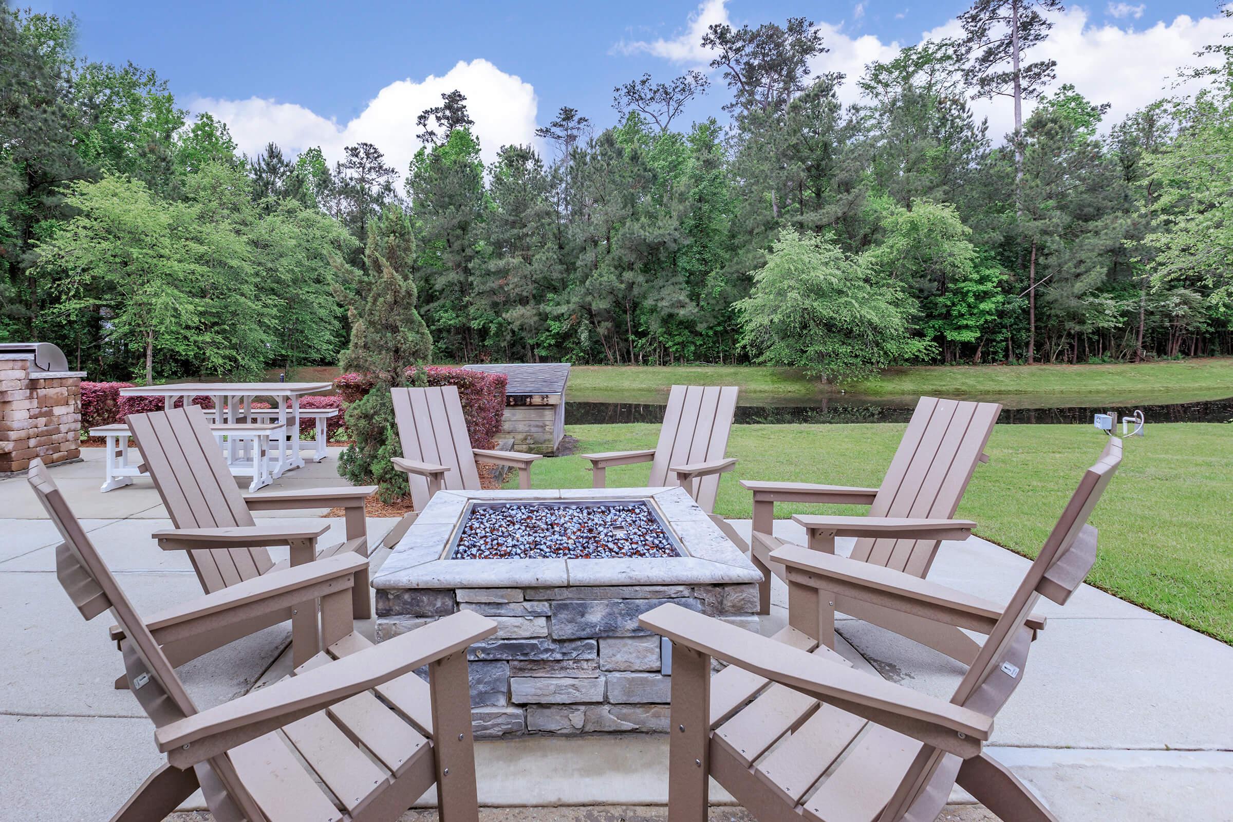 a couple of lawn chairs sitting on top of a picnic table