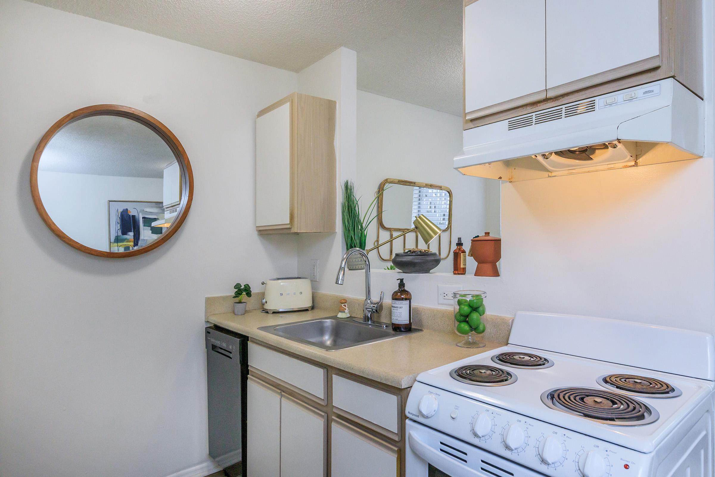 a kitchen with a stove and a sink