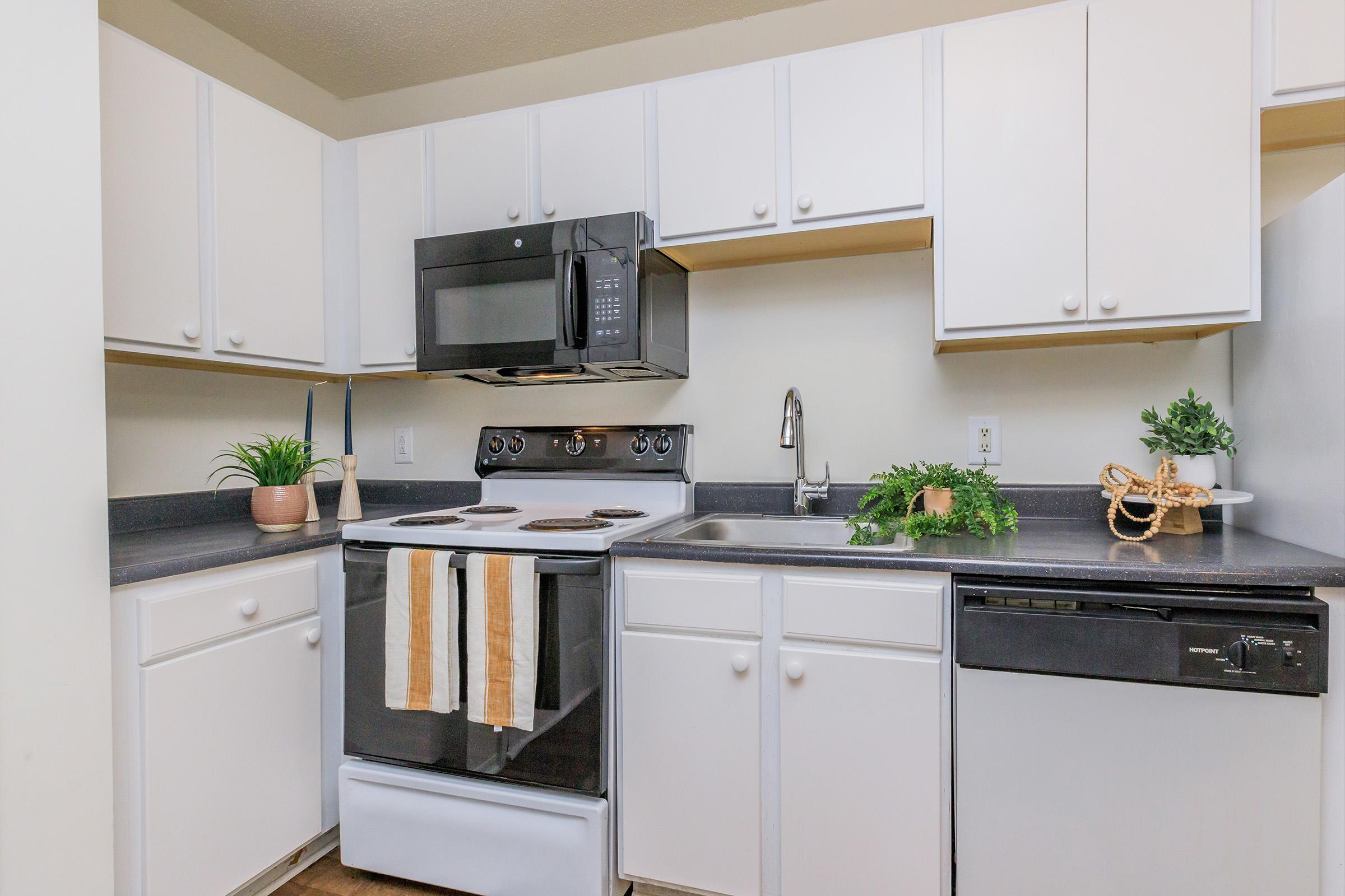 a kitchen with a stove top oven sitting inside of a refrigerator