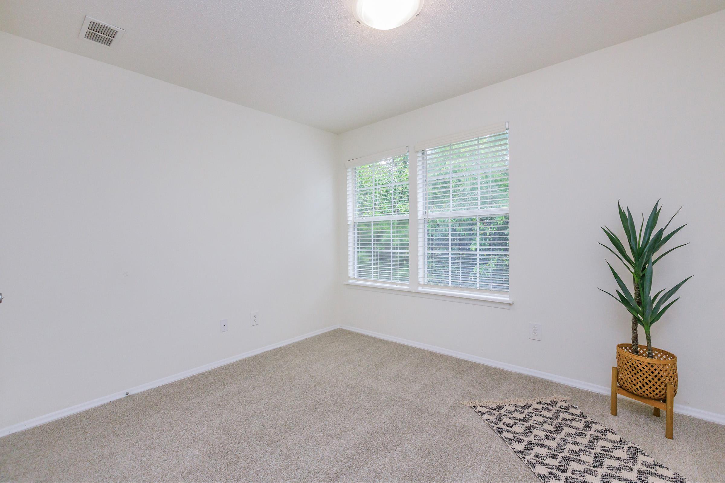 a living room next to a window