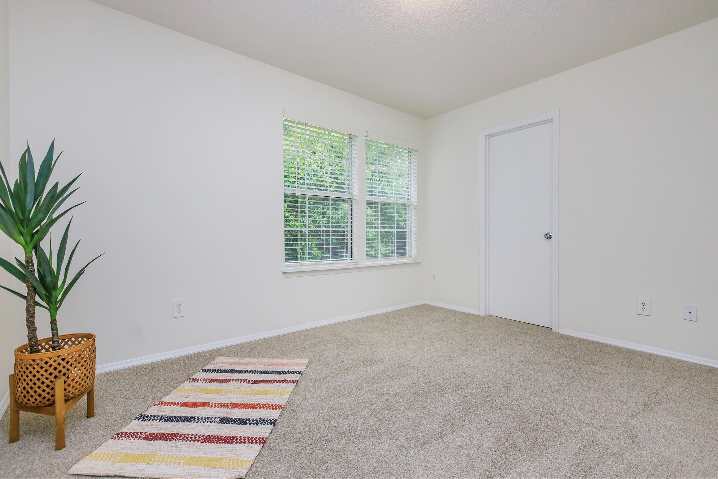 a room filled with furniture and a large window