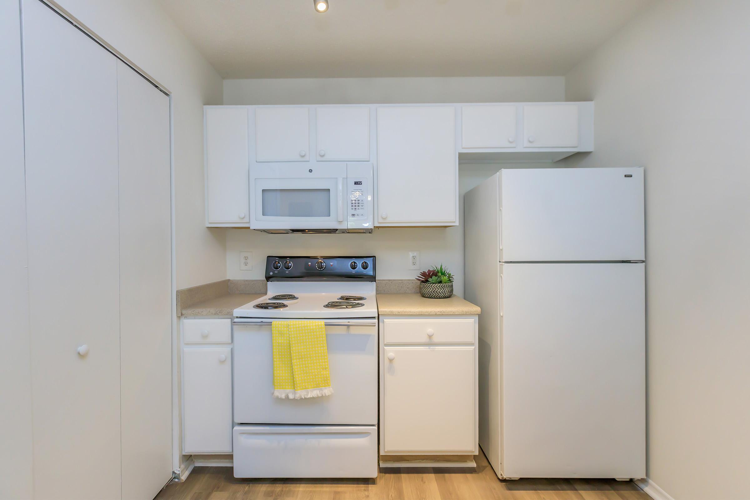 a kitchen with a stove top oven sitting inside of a refrigerator