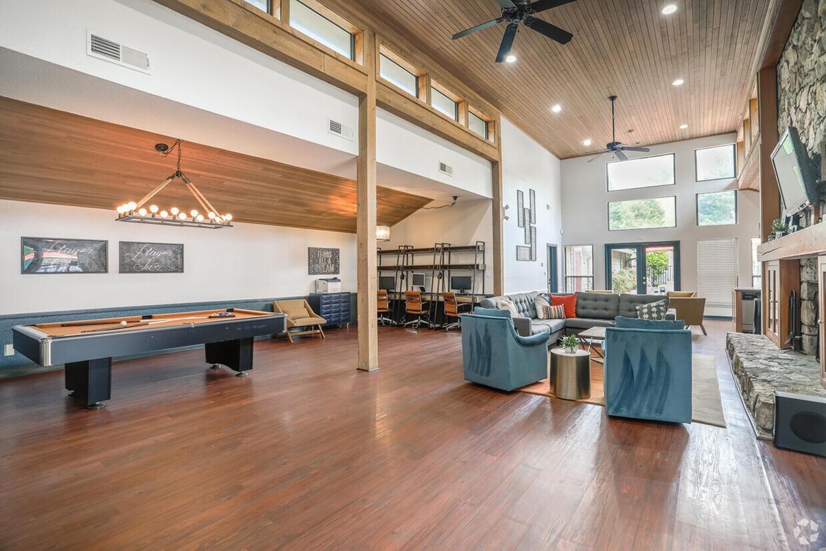 a room filled with furniture and a wood floor