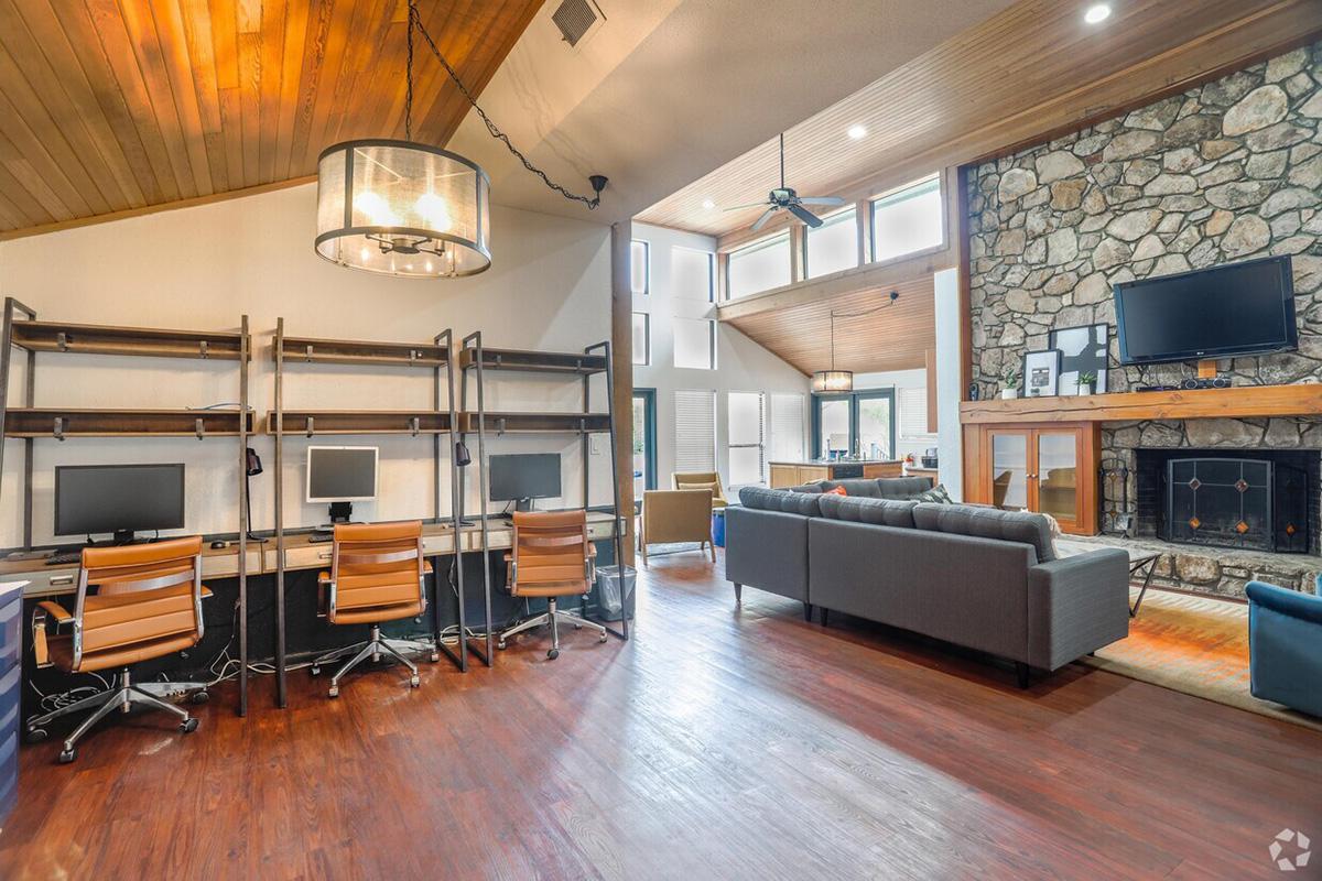 a room filled with furniture and a wood floor