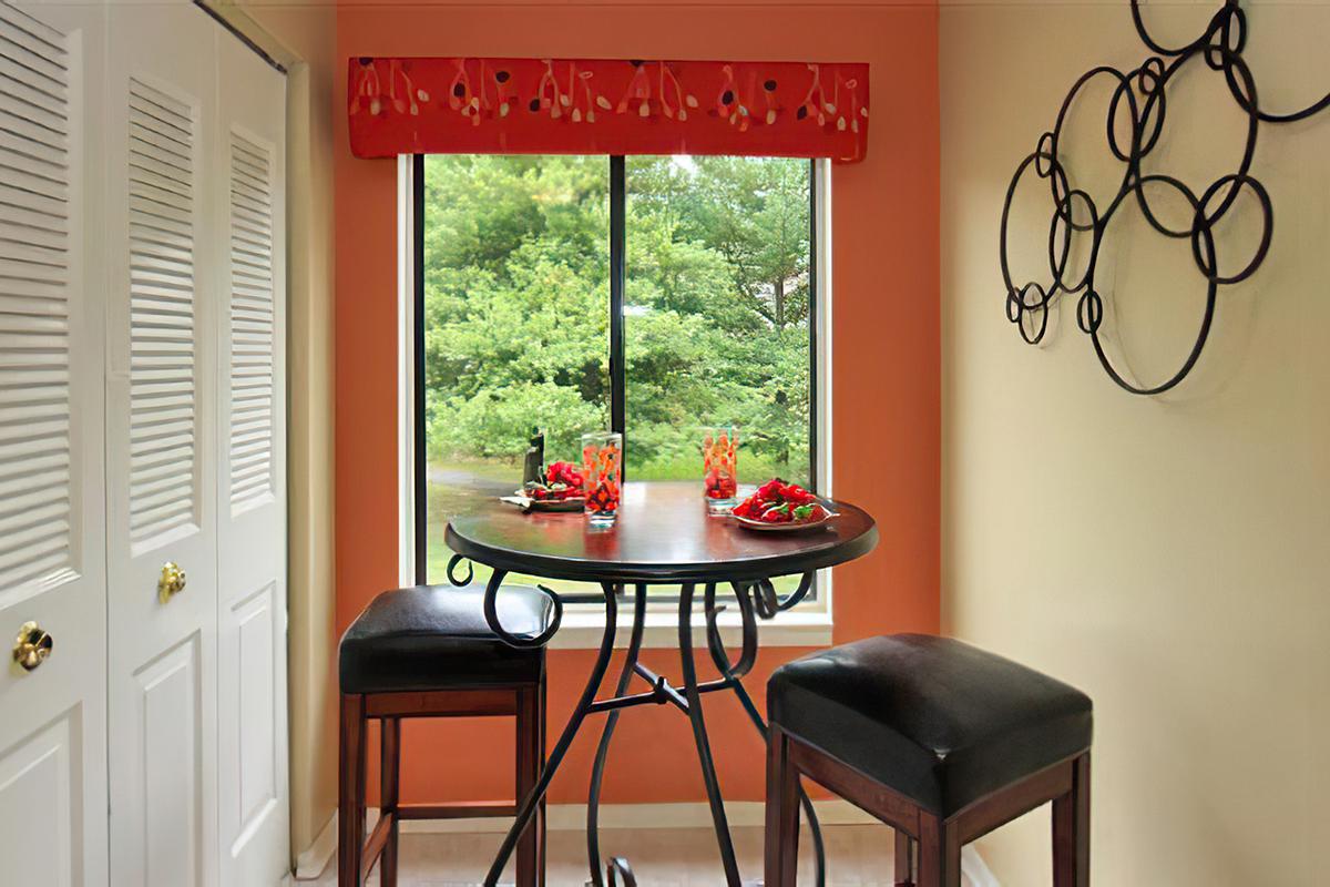 a chair sitting in front of a window