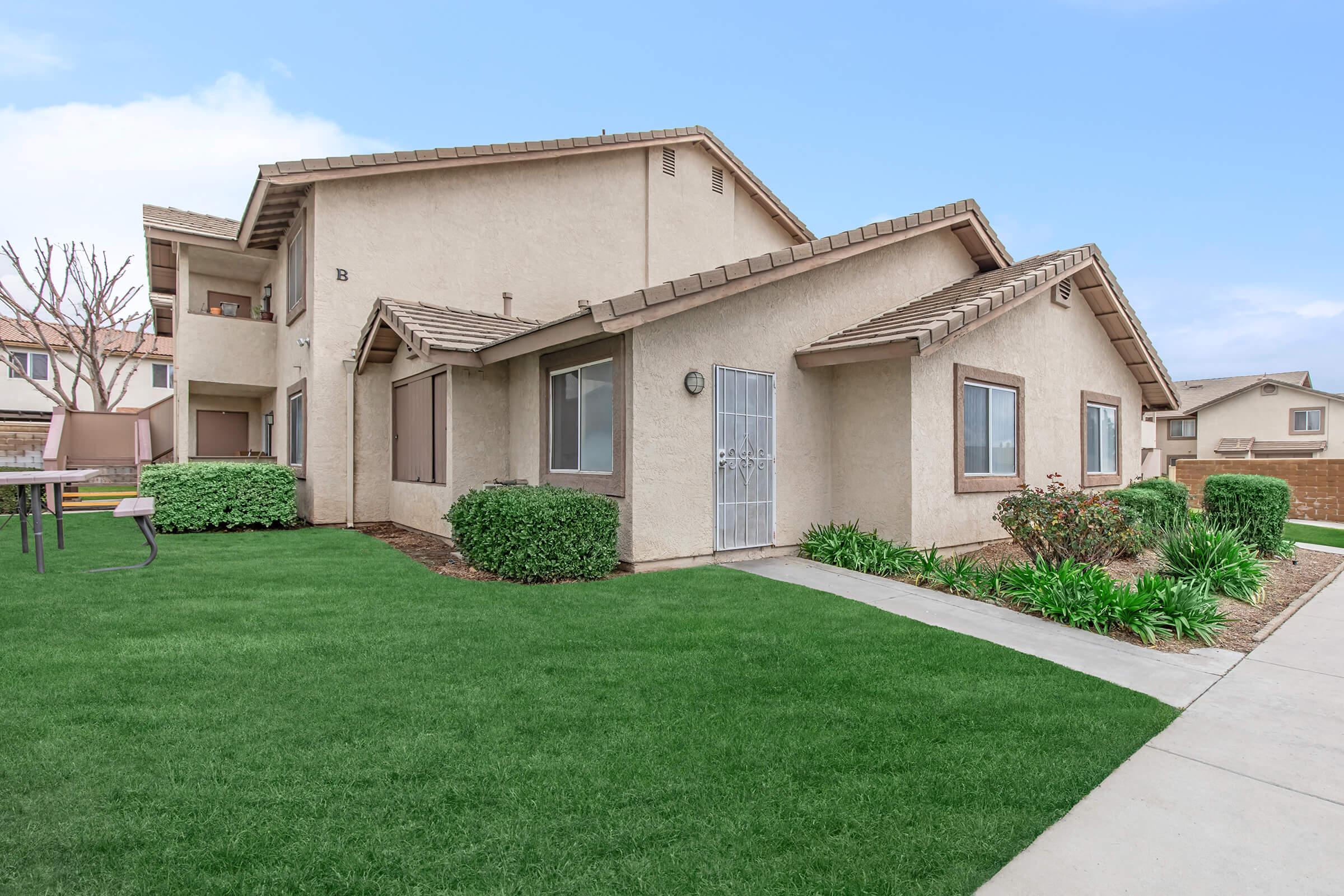 a large lawn in front of a house