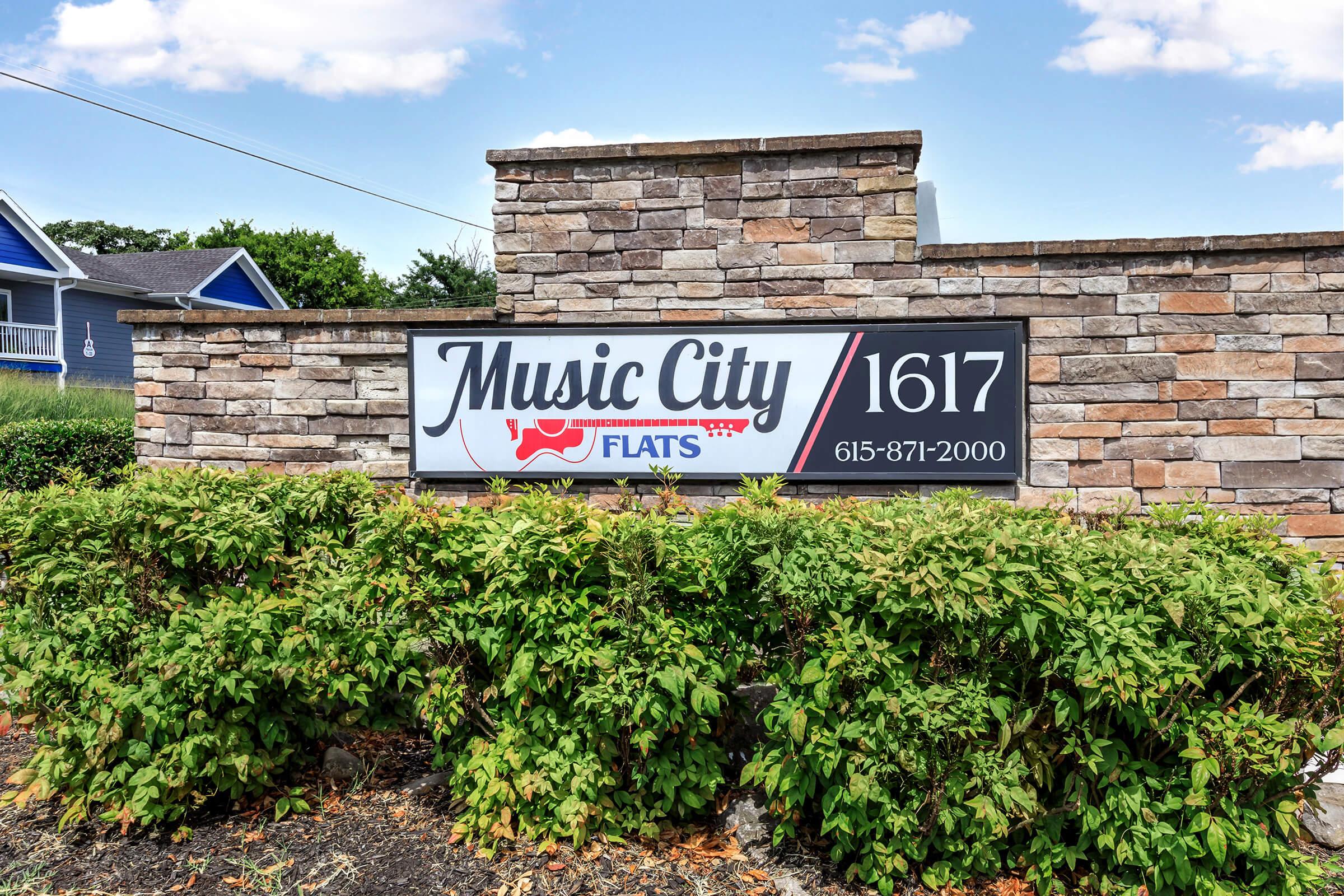 a sign in front of a brick building