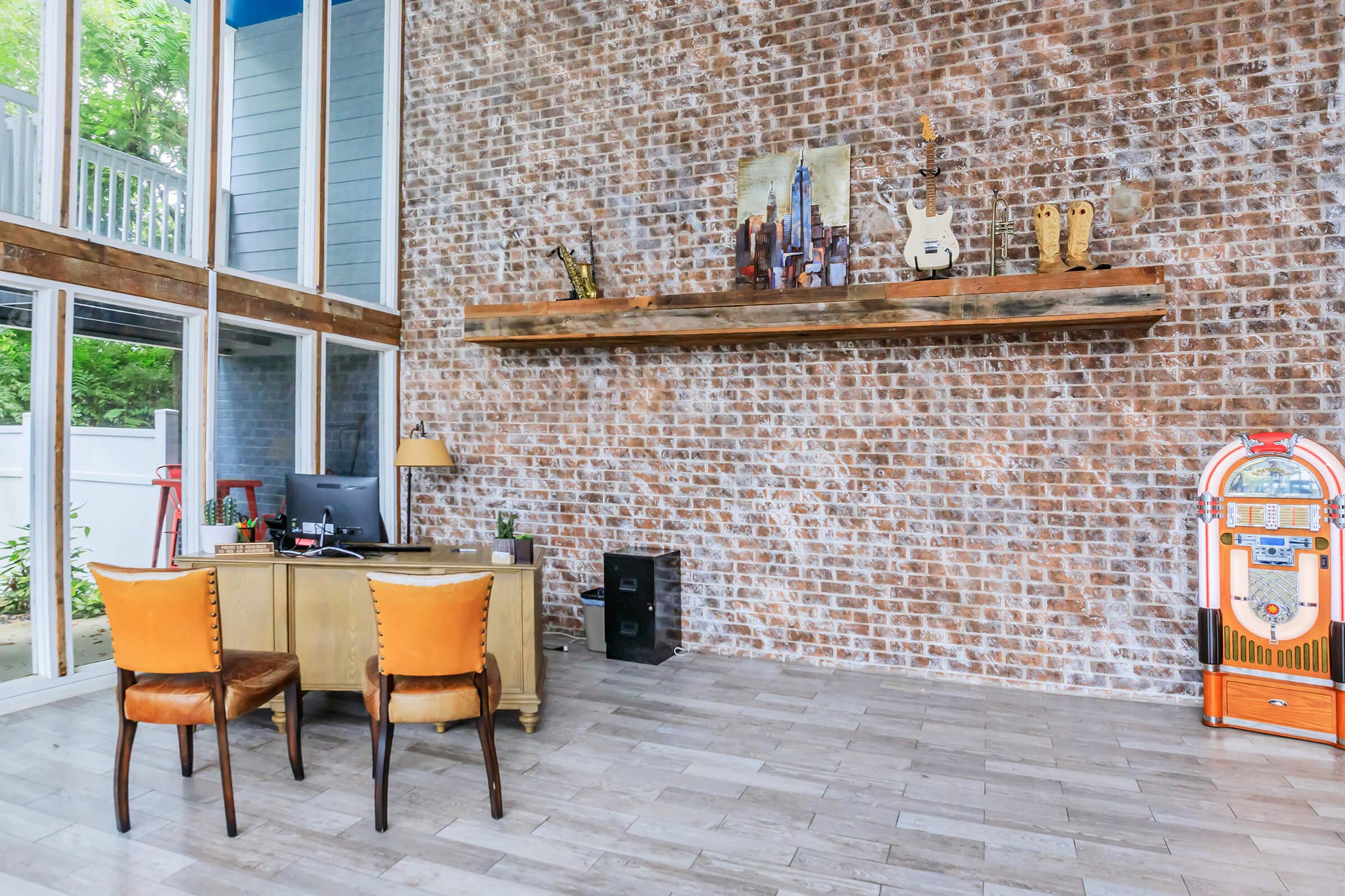 a bench in front of a brick building