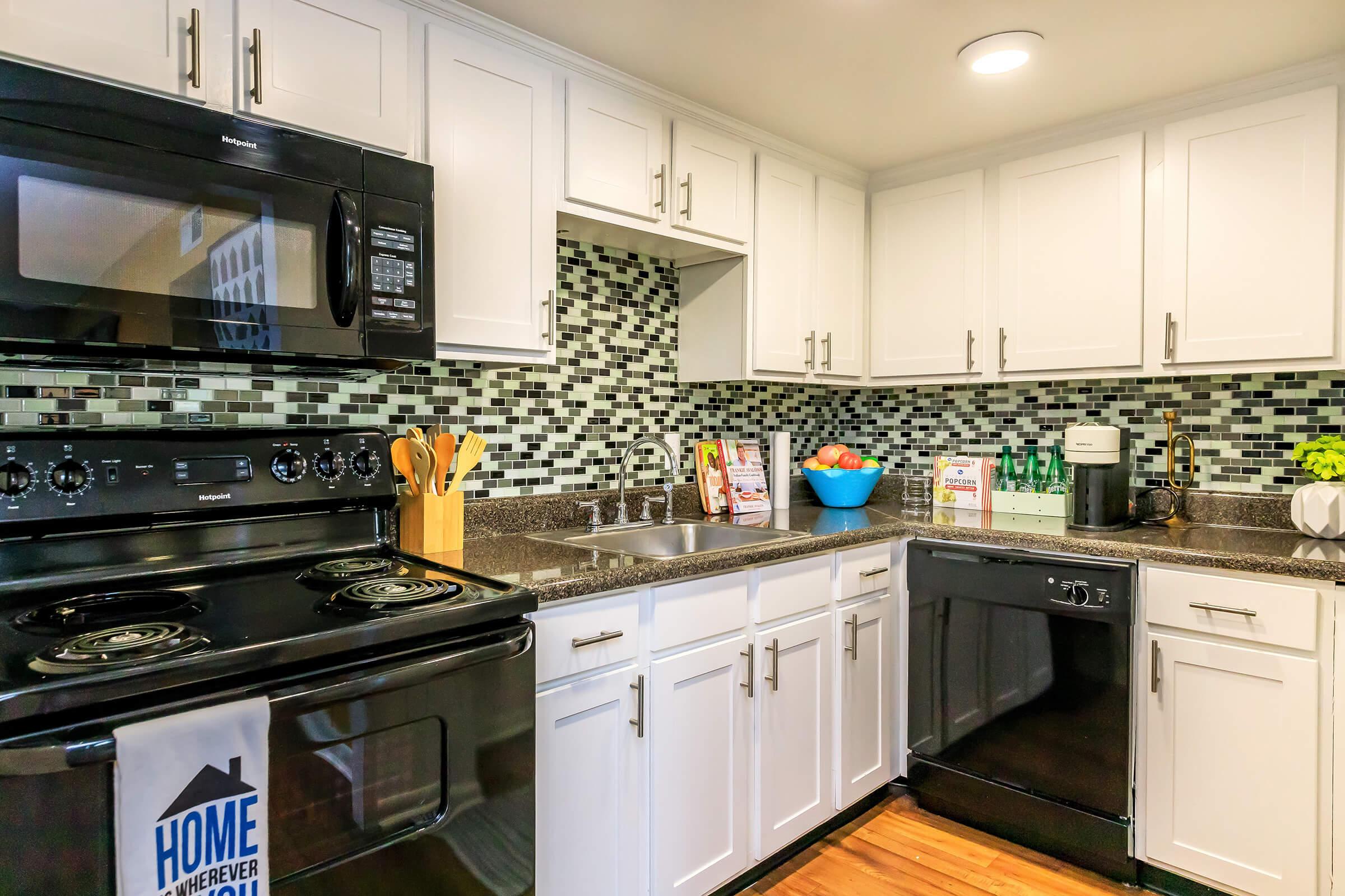 a large kitchen with stainless steel appliances