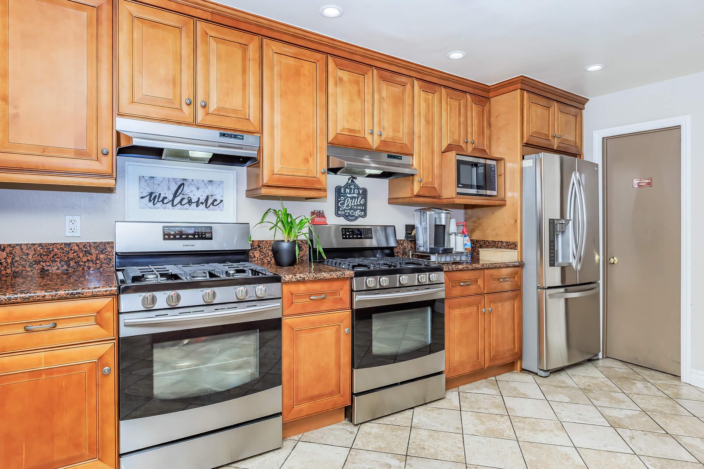 a kitchen with wooden cabinets