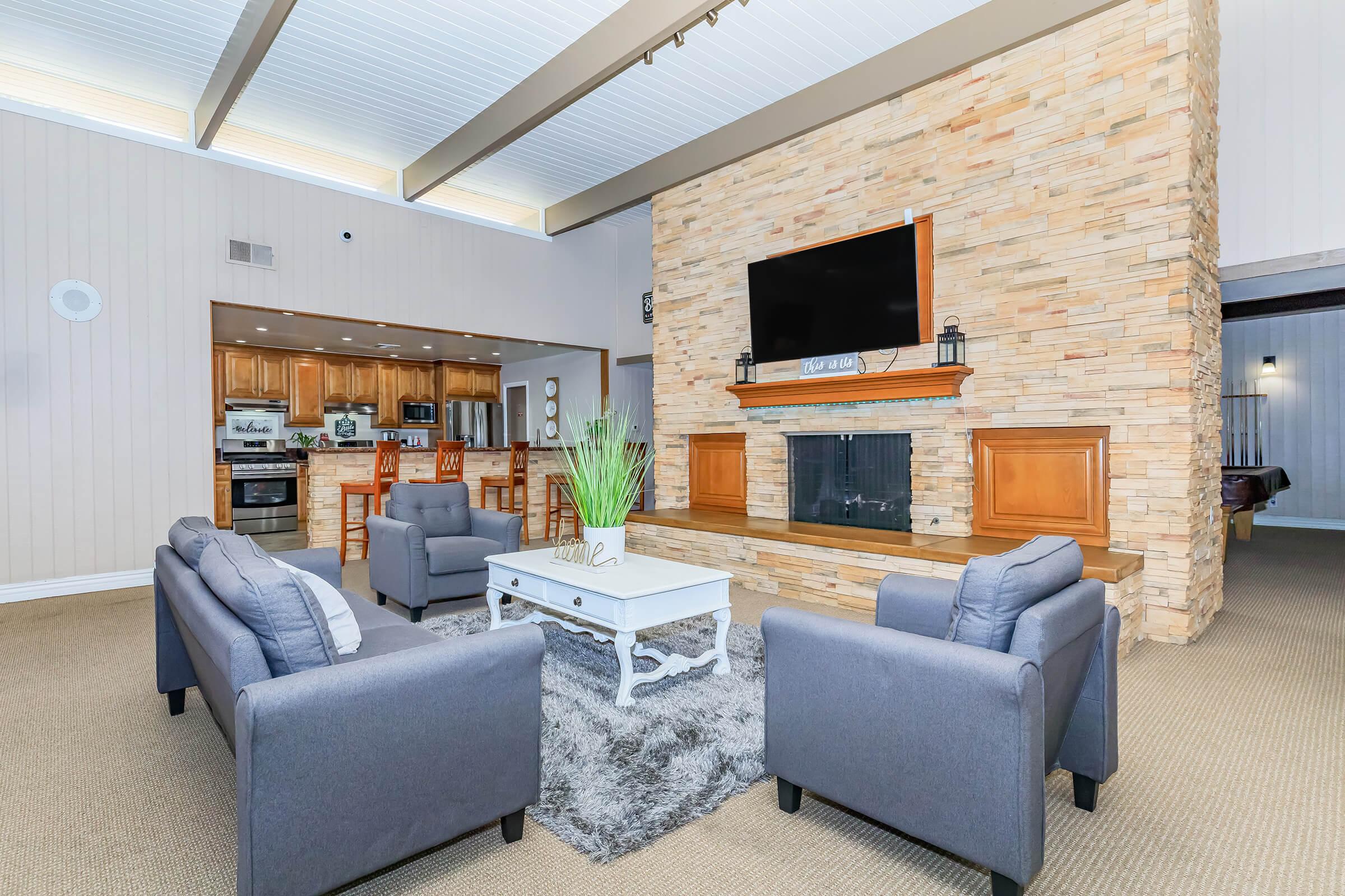 a living room filled with furniture and a large window