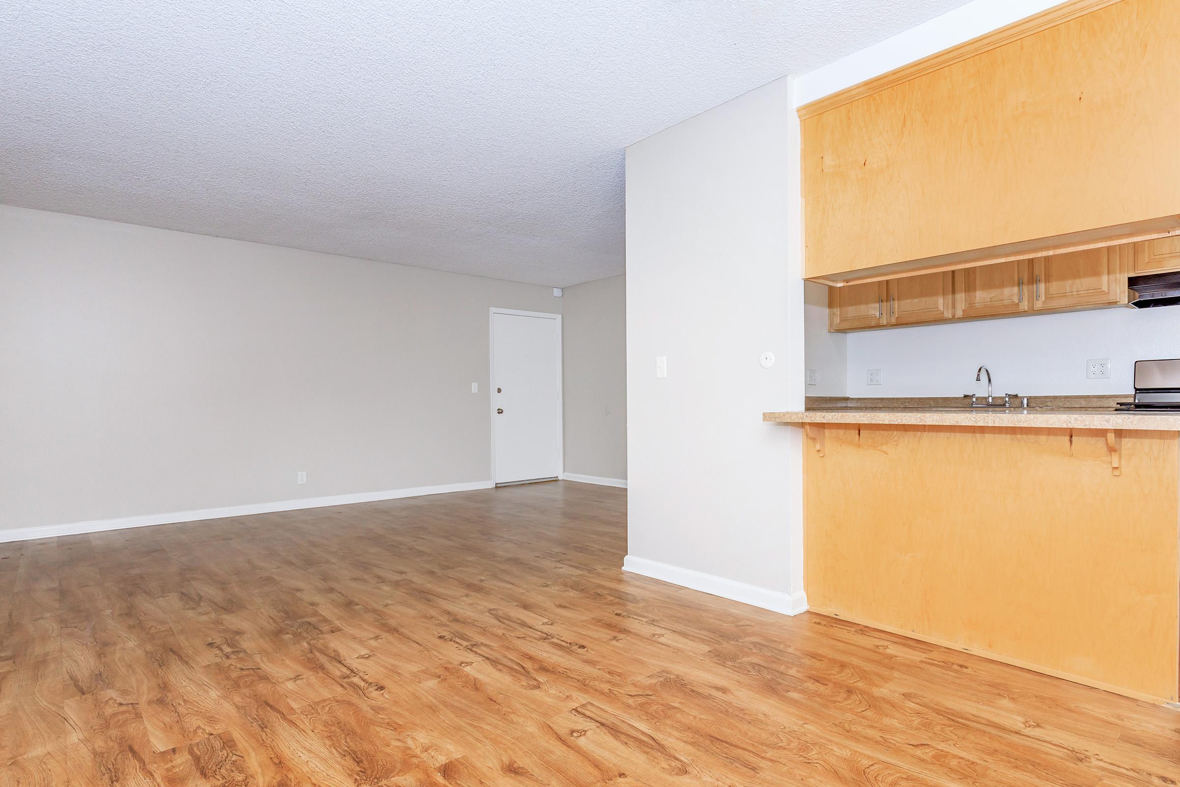 a kitchen with a building in the background