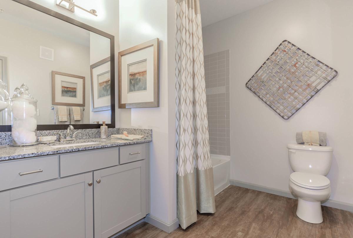 a kitchen with a sink and a mirror