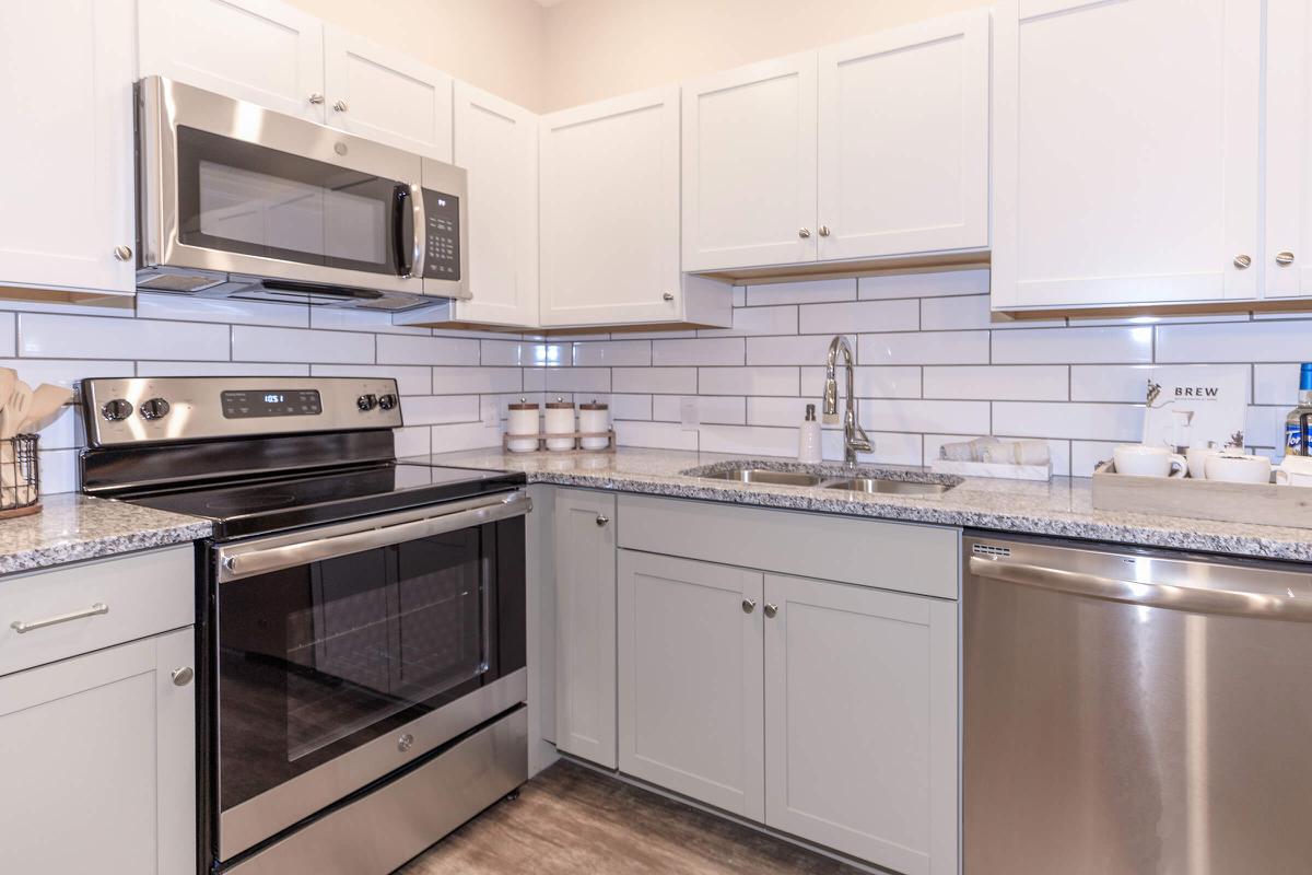 a kitchen with a stove top oven