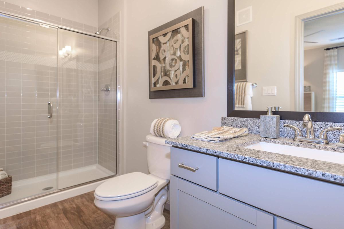 a large white tub sitting next to a sink