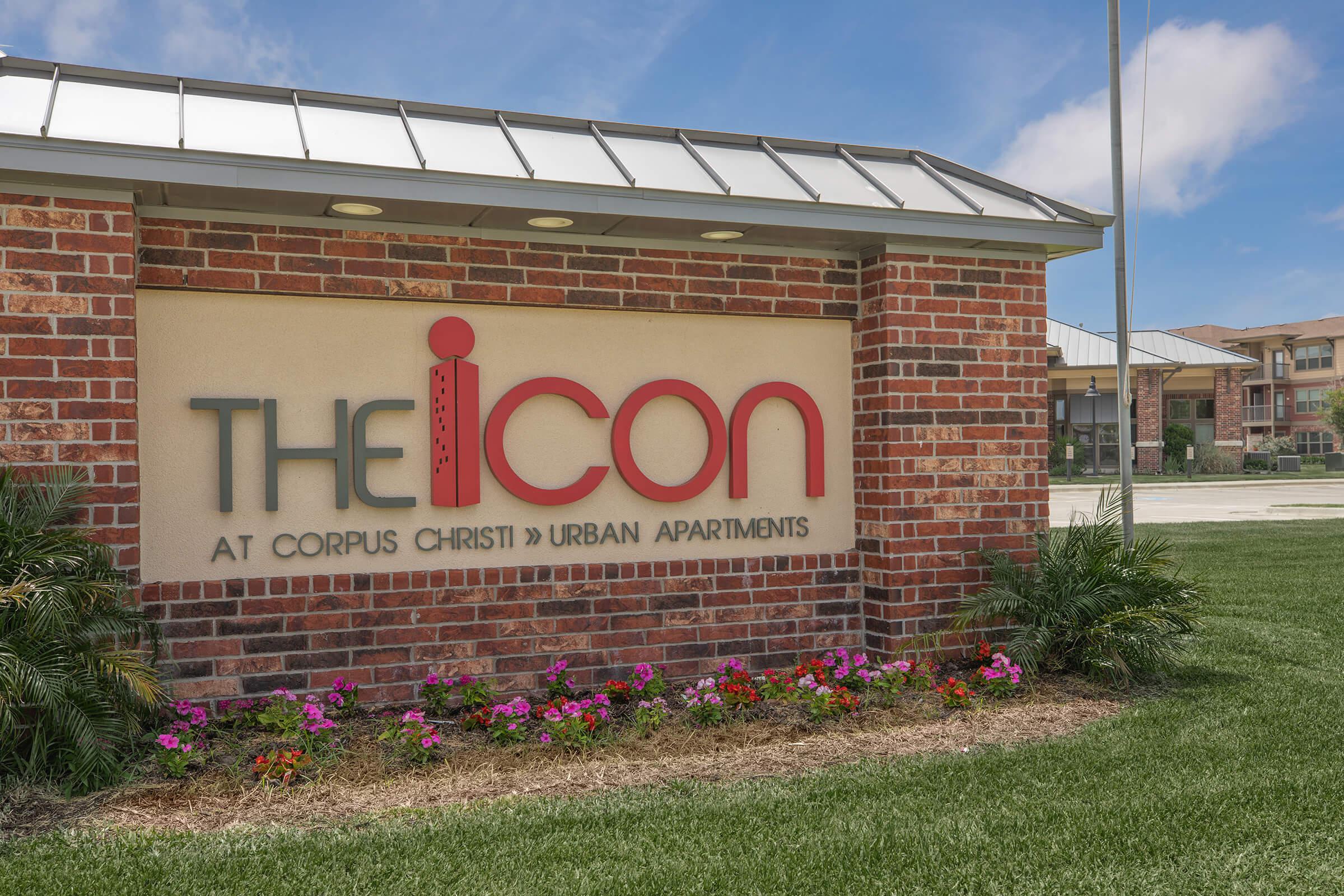 a sign in front of a brick building