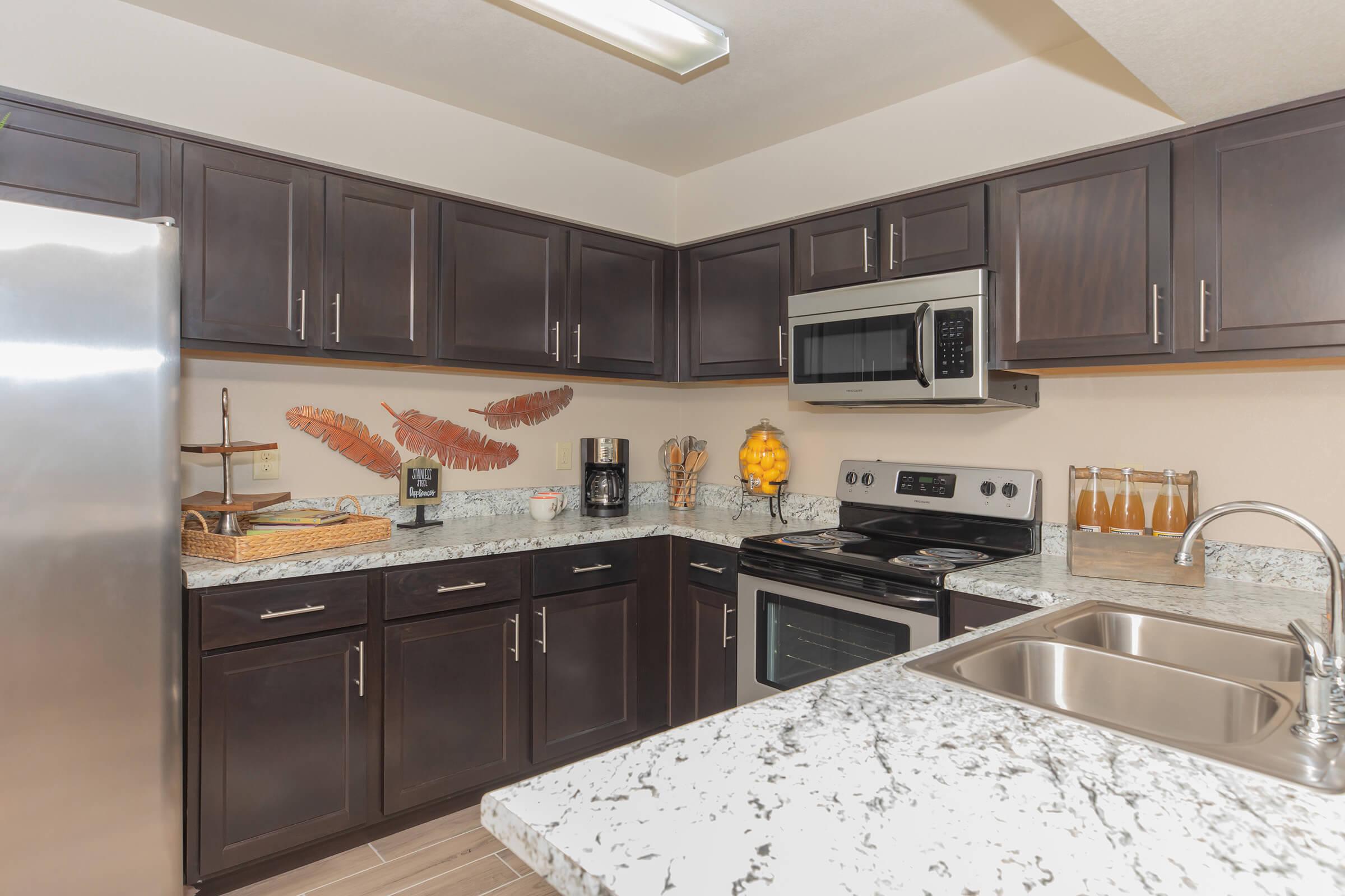 a modern kitchen with stainless steel appliances