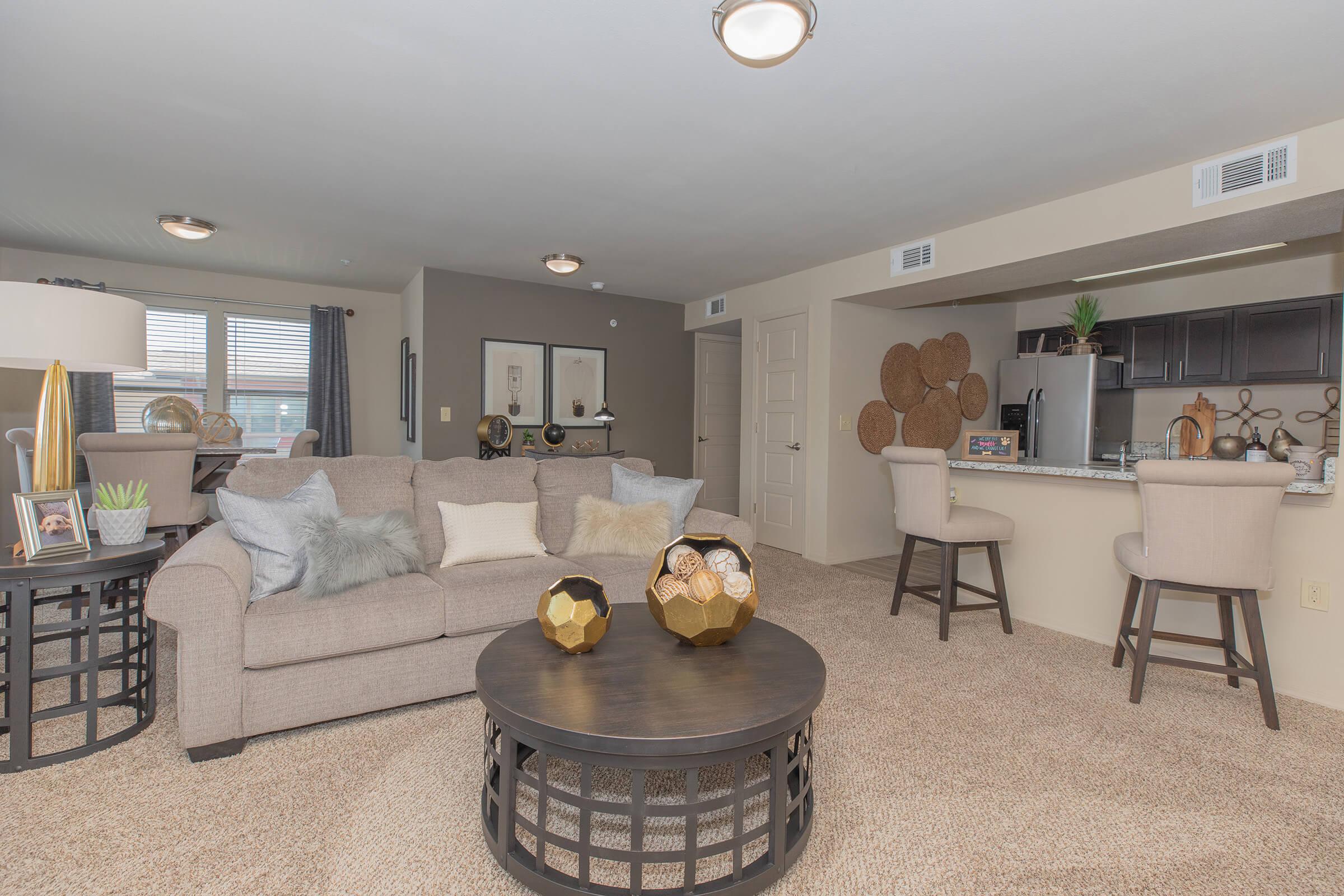 a living room filled with furniture and a fireplace