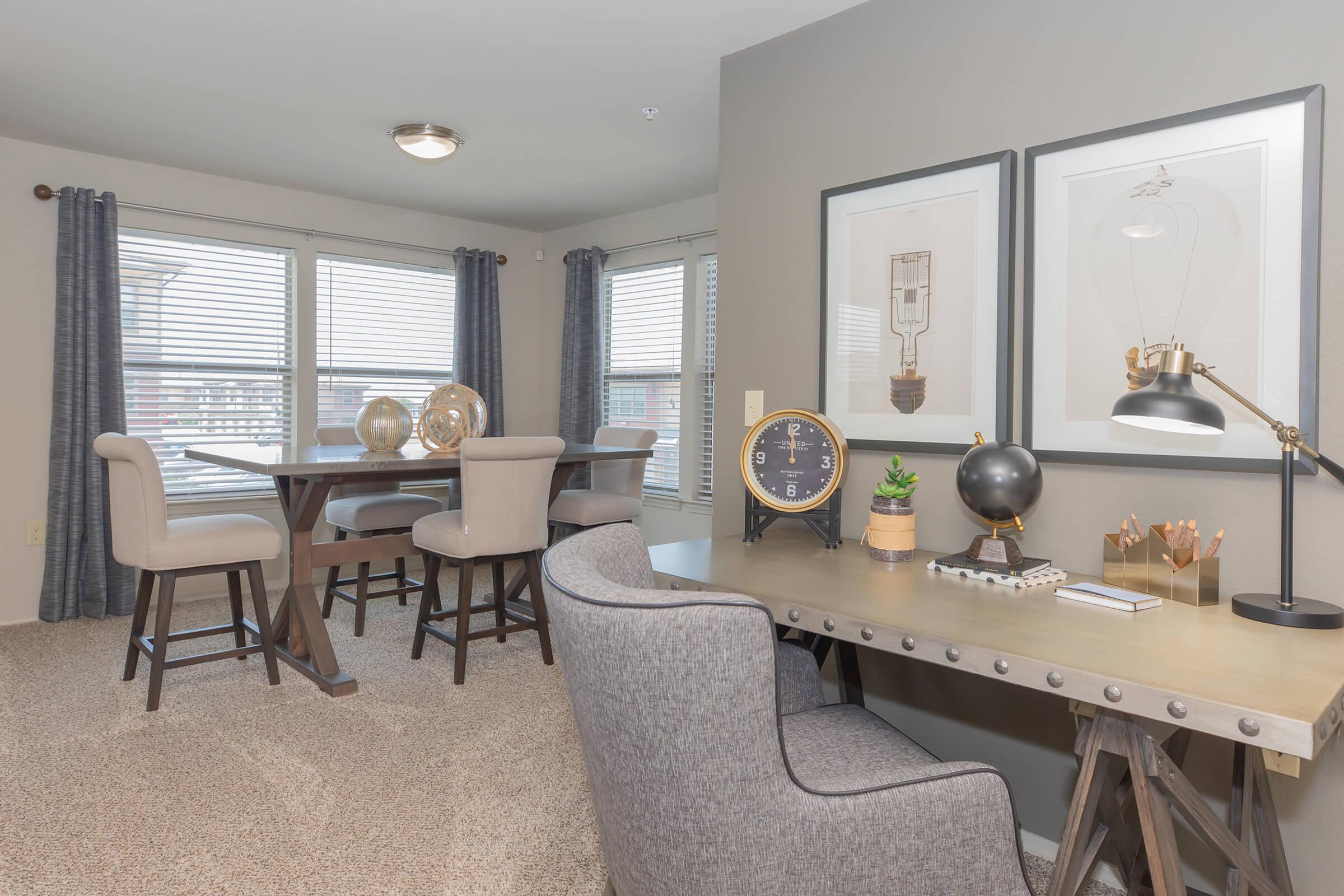 a living room filled with furniture and a large window