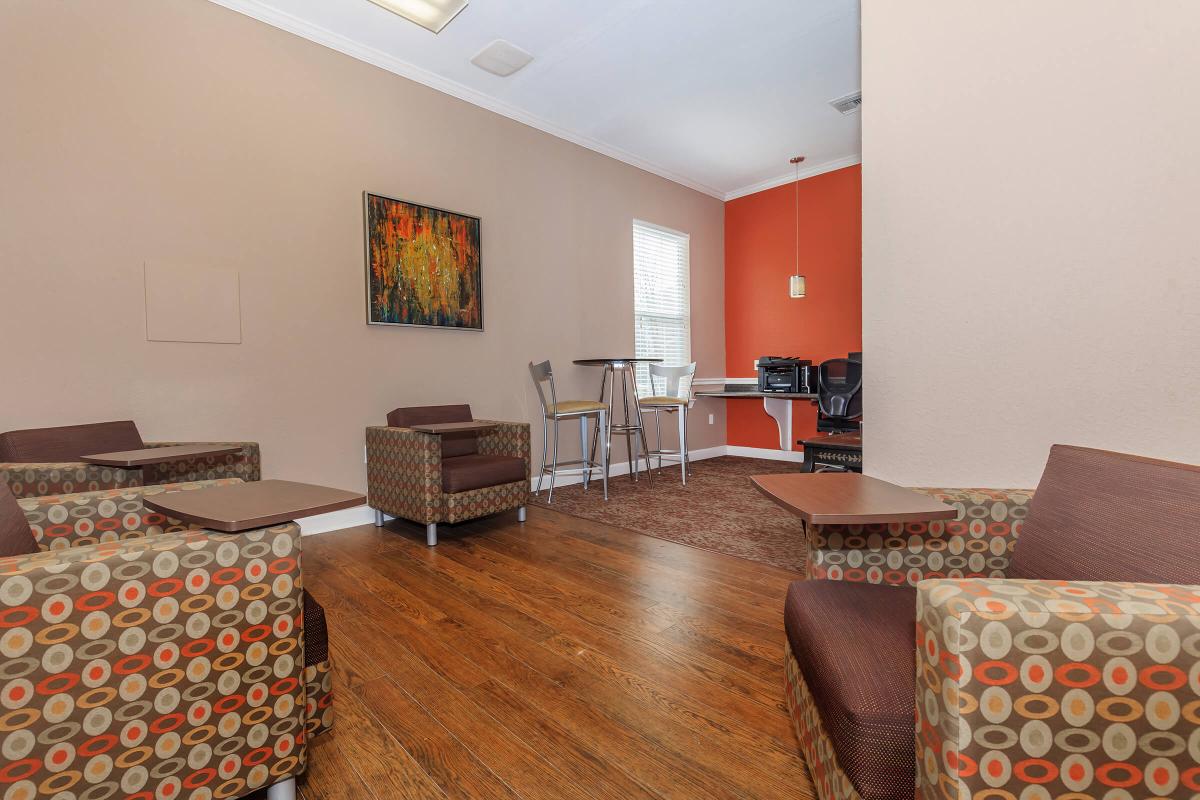 a living room filled with furniture and a flat screen tv