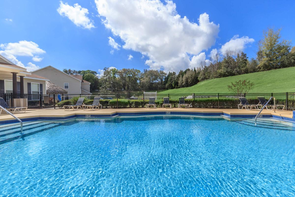 a pool next to a body of water