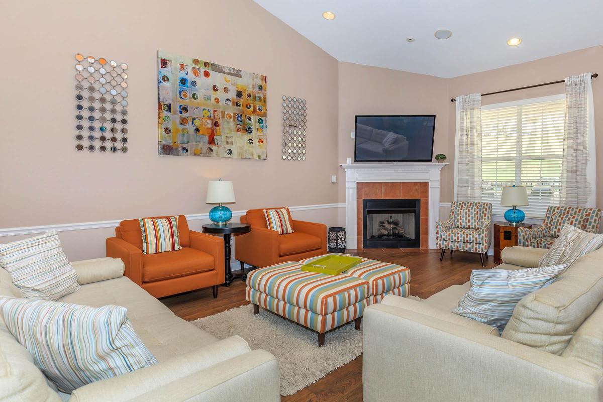 a living room filled with furniture and a fire place