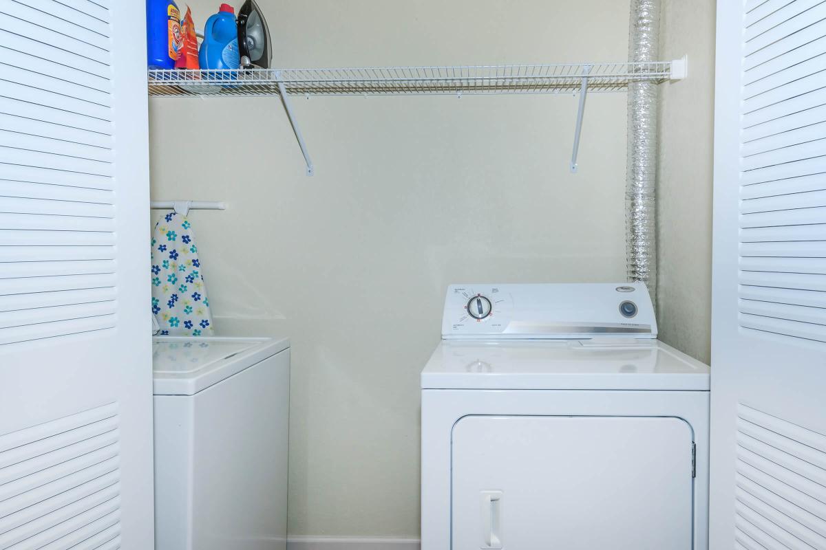 a white refrigerator freezer sitting next to a sink