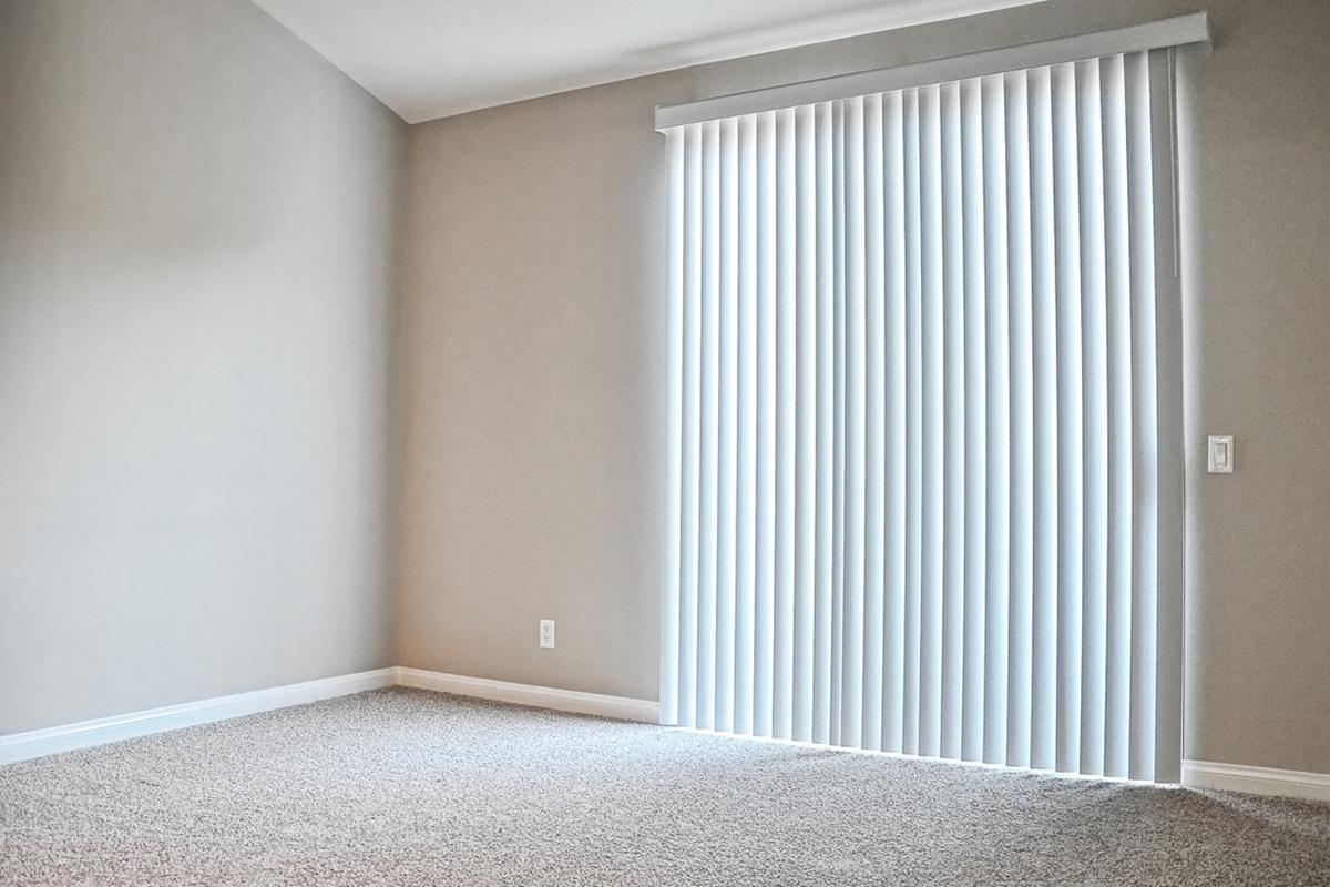 a bedroom with a large window